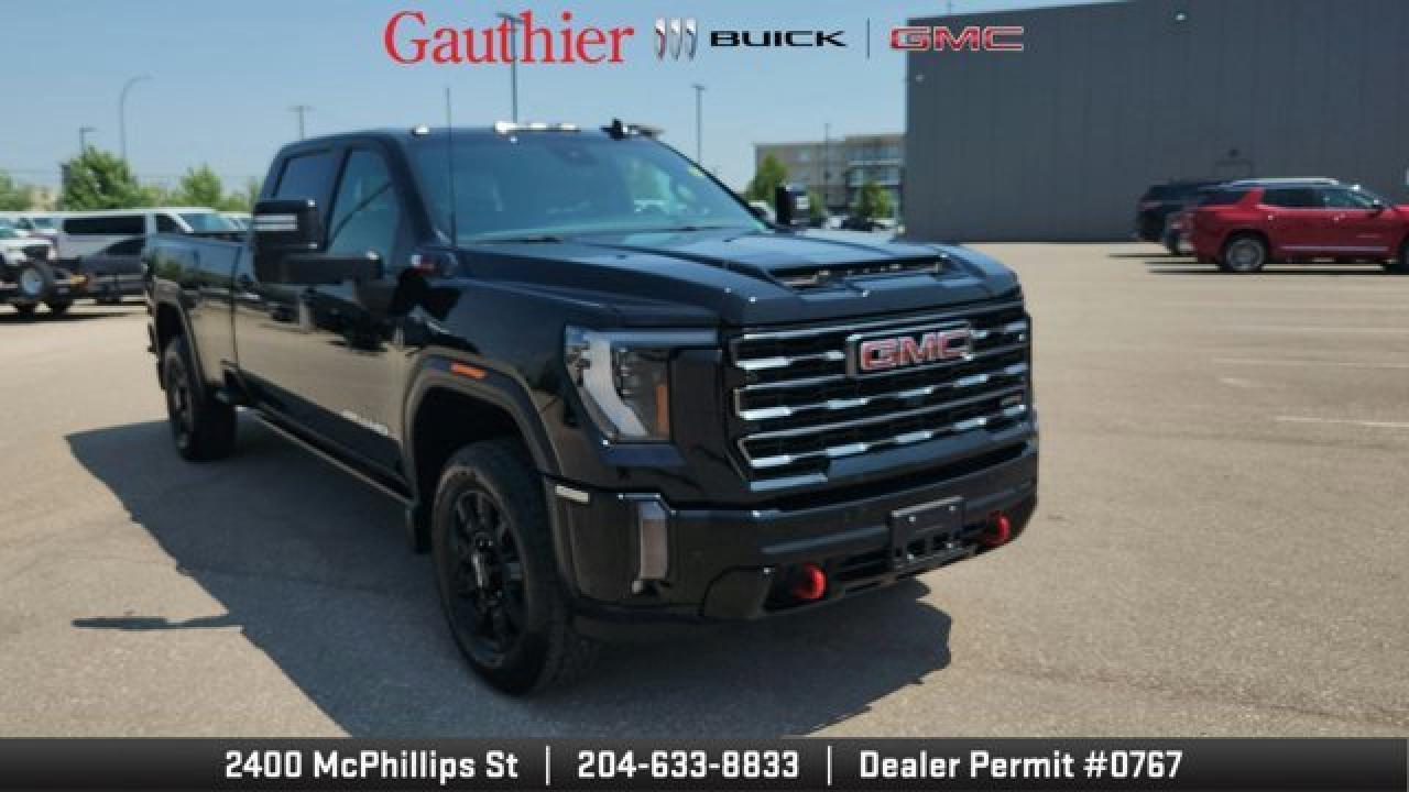 The 2024 Sierra 3500HD AT4 is a rugged, trail-ready 4WD heavy-duty crew cab. It comes equipped with off-road enhancements such as gloss-black 20 AT4 wheels, spray-on bedliner, MultiPro tailgate, power-retractable assist steps with LED lighting, and a rear electronic locking differential to maximize traction. Inside, the truck offers advanced tech and safety with GMCs Pro Safety suite---standard forward-collision alert, lane-departure warning, up to 14 camera views including transparent trailer vision---alongside a premium 13.4-inch infotainment display featuring Google built-in, wireless Apple CarPlay/Android Auto, and Bose audio available for enhanced connectivity and comfort.