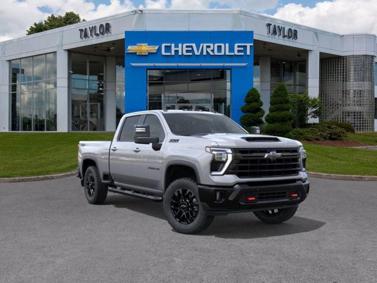 <b>Aluminum Wheels,  SiriusXM,  Trailering Package,  Apple CarPlay,  Android Auto!</b><br> <br>   Bold and burly, this Silverado 2500HD is built for the toughest jobs without breaking a sweat. <br> <br>This 2025 Silverado 2500HD is highly configurable work truck that can haul a colossal amount of weight thanks to its potent drivetrain. This truck also offers amazing interior features that nestle occupants in comfort and luxury, with a great selection of tech features. For heavy-duty activities and even long-haul trips, the Silverado 2500HD is all the truck youll ever need.<br> <br> This sterling grey metallic sought after diesel Crew Cab 4X4 pickup   has an automatic transmission and is powered by a  470HP 6.6L 8 Cylinder Engine.<br> <br> Our Silverado 2500HDs trim level is LT. This trim rewards you with an upgraded 13.4-inch infotainment screen with navigation capability and a digital drivers display. Also standard include a trailering package with hitch guidance, machined aluminum wheels, SiriusXM satellite radio, heated trailering mirrors, a locking tailgate, Apple CarPlay and Android Auto, and remote keyless entry. Safety features also include automatic emergency braking, front pedestrian braking, lane departure warning, forward collision alert, and following distance indicator. This vehicle has been upgraded with the following features: Aluminum Wheels,  Siriusxm,  Trailering Package,  Apple Carplay,  Android Auto,  Remote Keyless Entry,  Front Pedestrian Braking. <br><br> <br>To apply right now for financing use this link : <a href=https://www.taylorautomall.com/finance/apply-for-financing/ target=_blank>https://www.taylorautomall.com/finance/apply-for-financing/</a><br><br> <br/> See dealer for details. <br> <br>HST, licensing, and Federal luxury tax (if applicable) are extra. <br><br> Come by and check out our fleet of 80+ used cars and trucks and 160+ new cars and trucks for sale in Kingston.  o~o