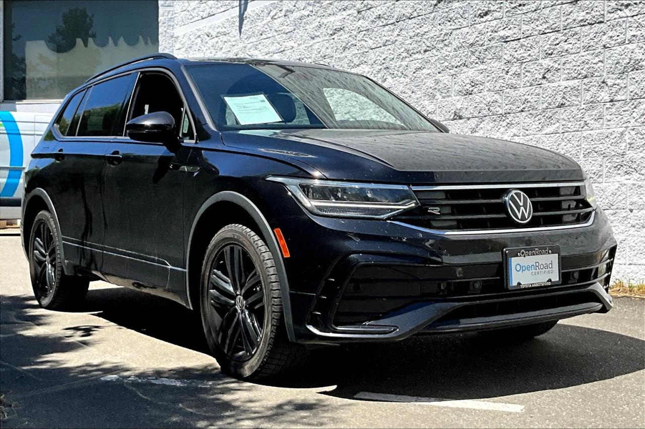 Turn heads in the 2022 Volkswagen Tiguan Comfortline R-Line Black 4MOTION. This sporty SUV features bold R-Line styling, black exterior accents, panoramic sunroof, heated seats, digital cockpit, and advanced driver assist features. Powered by a 2.0T engine with all-wheel drive, it blends performance with style. Come test drive it today!   At OpenRoad Toyota Abbotsford, we take the stress out of buying a used car by providing you with our TruePrice from the start! You will have peace of mind knowing you got our best price up-front, without the hassle of negotiating.  All OpenRoad Certified pre-owned vehicles must pass an extremely thorough 153-point safety inspection for your peace of mind. All vehicles will have a Carfax verified history report, as well as a safety inspection report and breakdown of all work performed. We pride ourselves in our transparency, and wish to provide you with all the info you need to be confident in your vehicle purchase. Give us a call or visit our showroom at 30210 Automall Dr in Abbotsford, BC!   List Price subject to $499 Documentation Fee, $499 Lease/Finance Fee, and applicable taxes. Dealer #40643