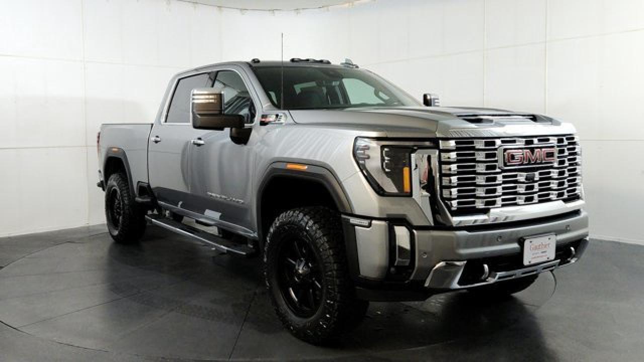 The 2025 Sierra 2500HD Denali stands out with its upscale trim featuring 20-inch Ultra-Bright machined wheels with bright chrome inserts, a distinctive chrome-accented grille and front bumper, and available luxuries such as authentic open-pore wood and patterned aluminum trim paired with perforated leather seating. Under the hood youll find the Duramax 6.6L Turbo-Diesel V8 with an Allison 10-speed automatic transmission, delivering around 470 horsepower and up to 975 lb-ft of torque for formidable towing capability. Inside, the Denali brings modern tech with its 13.4-inch infotainment touchscreen with wireless Apple CarPlay and Android Auto, a 12.3-inch digital driver display, and a full suite of Pro Safety driver-assistance. This model also comes equipped with power assist steps, heads-up display, a gooseneck / 5th wheel prep package, a universal vehicle module as well as an upfitter switch kit.