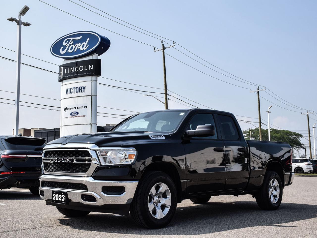 <p><strong>NOW AVAILABLE AT VICTORY RAM</strong></p>

<p>???????????????????????????????????????</p>

<h3><strong>2023 RAM 1500 SXT</strong></h3>

<p><em>Premium Value Meets Legendary Capability</em><br />
The perfect balance of rugged truck performance and modern comfort features at an exceptional value.</p>

<p>???????????????????????????????????????</p>

<p><strong>POWER & PERFORMANCE</strong><br />
?<strong>3.6L Pentastar® V6 (305HP/269 lb-ft torque)</strong><br />
?<strong>8-Speed Automatic Transmission</strong><br />
?<strong>Fuel Saver Technology with Stop/Start</strong></p>

<p>???????????????????????????????????????</p>

<p><strong>SXT PREMIUM PACKAGE</strong><br />
<strong>20 Aluminum Wheels</strong><br />
<strong>Body-Color Grille Surround</strong><br />
<strong>Power-Heated Mirrors</strong><br />
<strong>Rear Window Defroster</strong><br />
<strong>Satin Chrome Exterior Accents</strong></p>

<p>???????????????????????????????????????</p>

<p><strong>TECHNOLOGY & CONVENIENCE</strong><br />
?<strong>8.4 Touchscreen Display</strong><br />
?<strong>Apple CarPlay® & Android Auto</strong><br />
?<strong>Bluetooth® Hands-Free Calling</strong><br />
?<strong>Rear View Camera</strong><br />
?<strong>Remote Keyless Entry</strong></p>

<hr />
<p><span style=font-size:11pt><span style=font-family:Calibri,sans-serif><strong>Special Offer:</strong></span></span></p>

<p><span style=font-size:11pt><span style=font-family:Calibri,sans-serif><strong>Financing Special:</strong>Listed price available on approved credit for financed purchases. Pricing may vary with alternative payment methods.</span></span></p>

<p><span style=font-size:11pt><span style=font-family:Calibri,sans-serif><strong>Peace of Mind Included:</strong><br />
<span style=font-family:Segoe UI Symbol,sans-serif>?</span><strong>3-Month Comprehensive Warranty</strong>(for vehicles under 10 years old & under 160,000 km)<br />
<span style=font-family:Segoe UI Symbol,sans-serif>?</span><strong>No-Haggle, Live Market Pricing</strong> Transparent & Competitive<br />
<span style=font-family:Segoe UI Symbol,sans-serif>?</span><strong>All-Inclusive Pricing:</strong>Fees, Reconditioning, and Full Detailing Included (<em>Taxes & Licensing Extra</em>)</span></span></p>

<hr />
<p><span style=font-size:11pt><span style=font-family:Calibri,sans-serif><strong>Additional Details:</strong></span></span></p>

<ul>
 <li><span style=font-size:11pt><span style=font-family:Calibri,sans-serif><strong>Keys:</strong>Standard with one key. Additional keys (if provided by the previous owner) included at no cost. Optional key purchases available upon request.</span></span></li>
</ul>

<p><span style=font-size:11pt><span style=font-family:Calibri,sans-serif><strong>Visit Victory Ford Lincoln Today</strong><br />
<em>Schedule your appointment to experience this exceptional vehicle.</em></span></span></p>