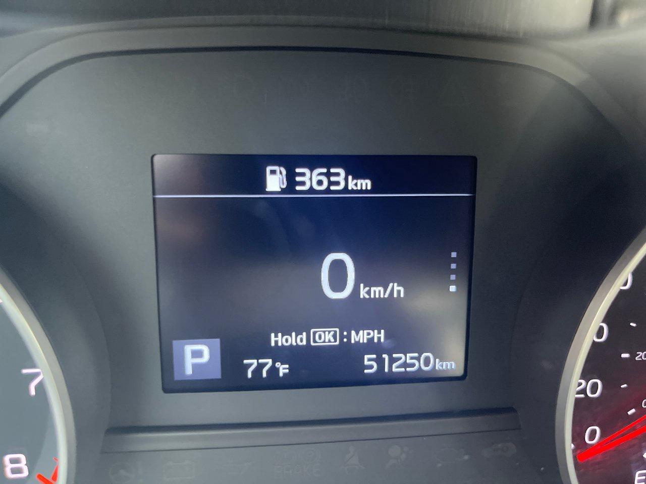 12715428
