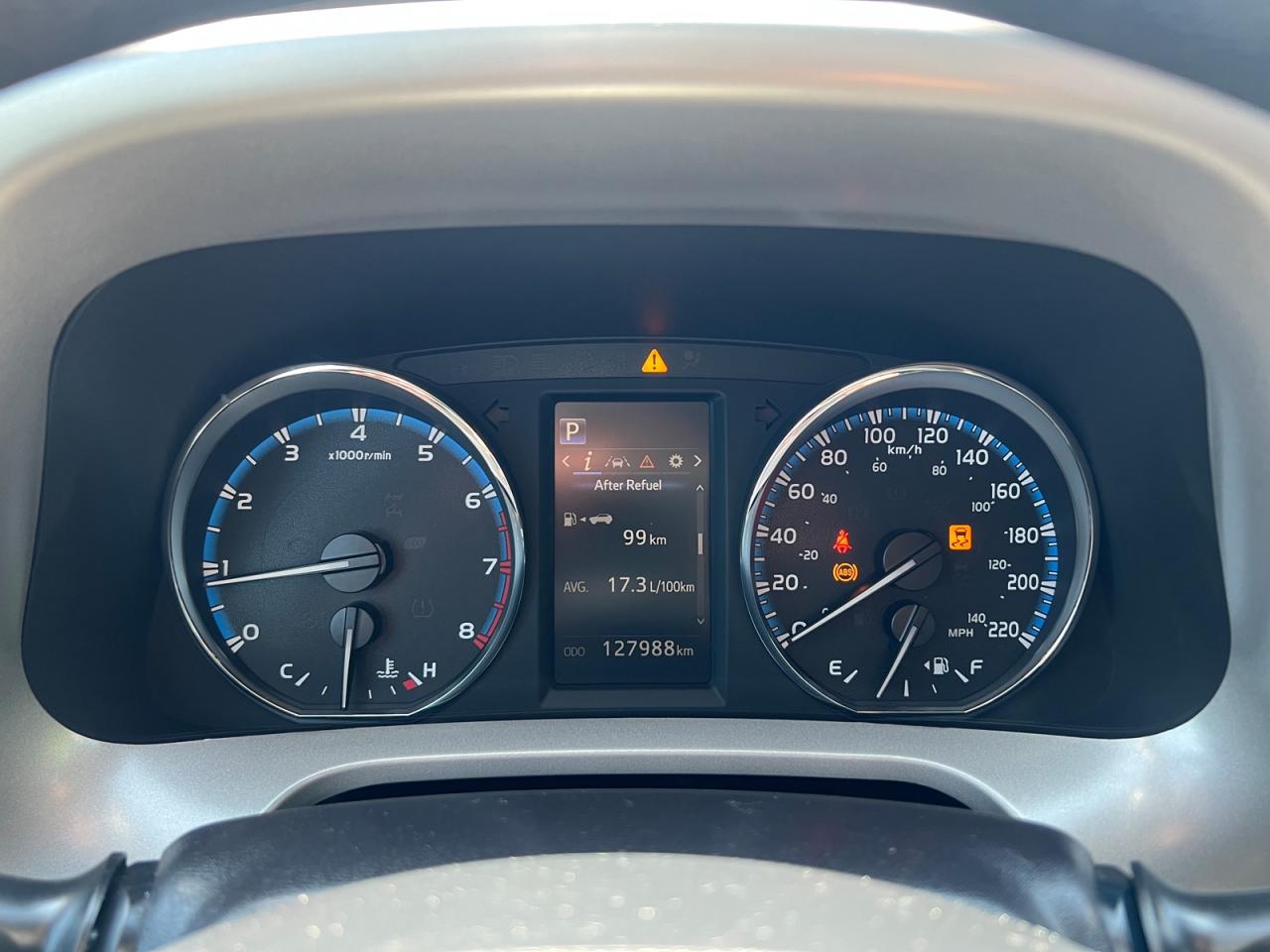 12725772