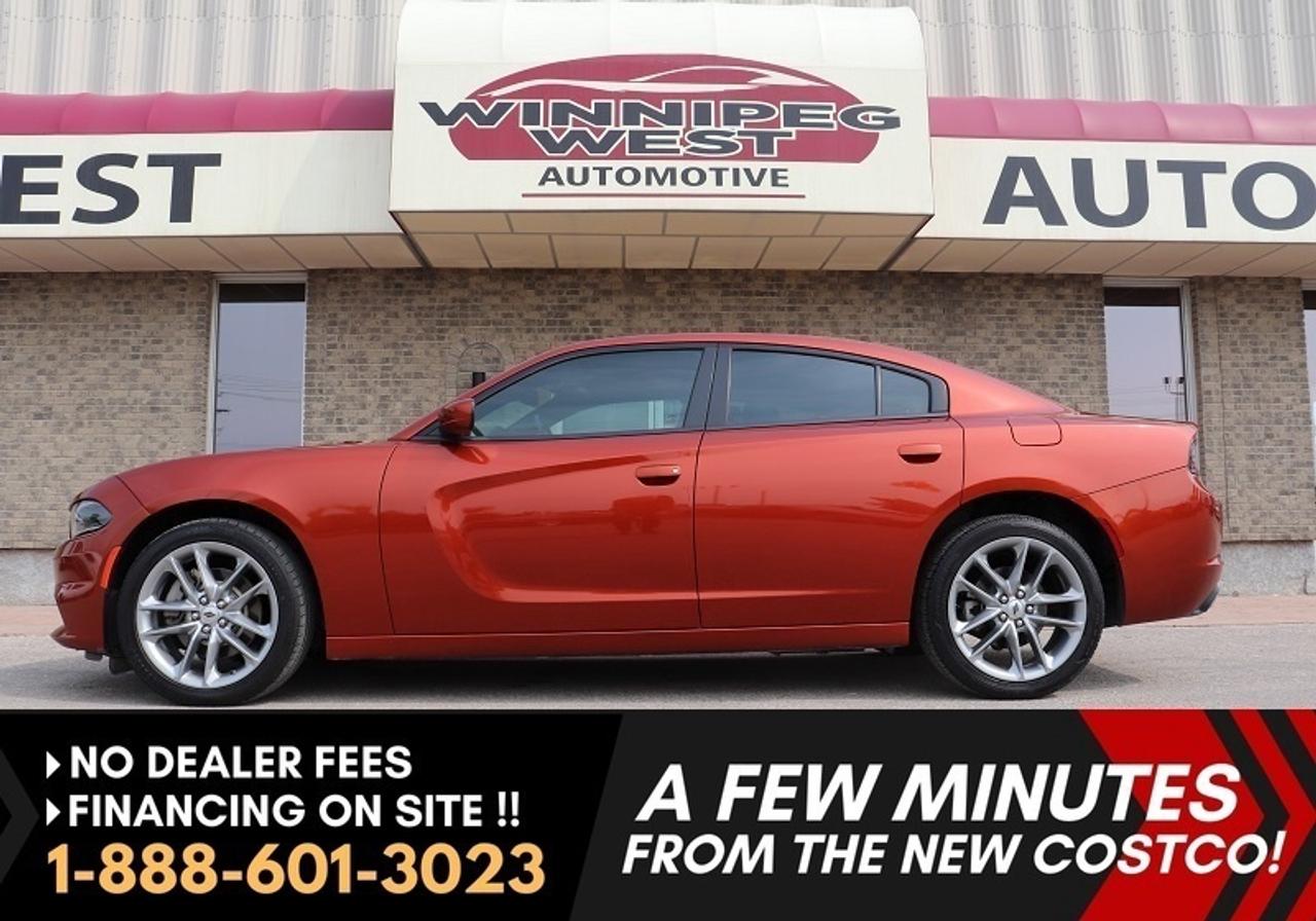 *** Dealer arranged financing on site! Quick, Simple,  no calls or waiting on bank appointments required!! Drive away today ***   NO ADMINISTRATION FEES!!

***AWD CHARGER, CONQUER WINTER IN STYLE*** VERY SPORTY/LUXURY ALL WHEEL DRIVE AT A GREAT PRICE POINT! LOCAL TRADE, EXTRA CLEAN AND GREAT COLOUR COMBO, FULLY LOADED 2021 DODGE CHARGER SXT PREMIUM EDITION AWD WITH THE PROVEN PEPPY AND FUEL SIPPING 300HP 3.6 V6  ENGINE, LOADED WITH ALL OPTIONS, INCLUDING HEATED/COOLED LEATHER SEATS, SUNROOF, PREMIUM SOUND & WHAT A STUNNING COLOR COMBO! GREAT PRICE POINT ON THIS BEAUTIFUL CHARGER AWD LUXURY SEDAN LOADED WITH ALL THE BELLS AND WHISTLES!!!

- Pentastar VVT 3.6-liter V6 (300 hp) GREAT Fuel economy!!
- 8-speed automatic with Sport/Manual mode
- Smart all-wheel drive for greater fuel economy
- Dual Exhaust
- Premium Heated and cooled Nappa Leather Seating
- Power memory drivers seat
- Sport buckets and full sport center console/shifter
- Heated steering wheel and rear seats
- Power tilt/Tele Wheel
- Power 2 way sunroof
- Remote and Keyless entry / push button start
- Factory remote starter
- Dual-zone automatic climate control
- Uconnect 4C 8.4-inch premium infotainment system with Apple Carplay and Android projection 
- Premium Alpine Sound System
- Navigation
- Parking system plus with rear view camera
- Blind spot and lane departure warning
- All Weather Mats
- Darker tinted windows
- 19-inch premium Sport Aluminum Alloy wheels on A/S tires
- So much more 

SUPER SHARP & LOADED LOADED LOADED DODGE CHARGER AWD, LEATHER HEATED AND COOLED SEATS, HEATED STEERING WHEEL AND REAR SEATS, SUNROOF, NAVIGATION AND SO MUCH MORE! WHAT A GREAT DEAL!  GREAT OPTIONS,  BEAUTIFUL COLOUR COMBINATION (SINAMON STICK ORANGE, OVER BLACK NAPPA LEATHER) AND SUPPLE LUXURY SIGNIFIES THIS STUNNING SPORT/LUXURY SEDAN. This beautiful Charger is not only sporty but full of luxuries! Fully equipped with the 3.6L Pentastar VVT 300HP v6 engine with Smart AWD, power directed through the 8-speed smooth shifting transmission this car gives you not only great fuel economy but great performance when wanted, in the summer or winter!!  Truly Fully loaded with all the luxury options, enhanced Driving /safety packages and so much more. The list of features is long!! It is Like new condition in all respects, pride of ownership is very evident and a great looking car! A very rare find like this one - Truly none nicer at this price point.

Comes with a Manitoba Safety Certification, and we have many Extended Powertrain warranties available on your vehicle purchase up to 10-year coverage (on eligible vehicles see dealer for details). Financing on site with Zero down financing OAC. Trades accepted. View at Winnipeg West Automotive Group, 5195 Portage Ave. (only a couple of minutes past the new Costco) Dealer permit # 6007, Call now 1(888) 6O1-3O23. This Car is located in Winnipeg Manitoba,  however we can have it shipped anywhere in North America relatively inexpensively.
