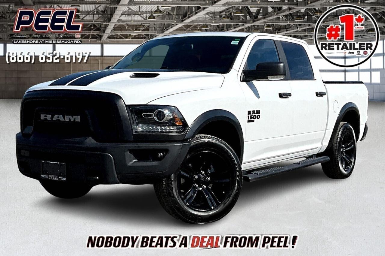 COME SEE WHY NOBODY BEATS A DEAL FROM PEEL! Your Source for ALL make and models used cars and trucks. Canadas #1 Stellantis Retailer for 9 years & counting!!

2023 Ram 1500 Classic Warlock Crew Cab 4X4 | 3.6L V6 | Bright White | Premium Cloth Bucket Seats | Heated Seats | Heated Steering Wheel | Power Sunroof | Uconnect 8.4" Touchscreen Display | Apple CarPlay & Android Auto  | Class IV Hitch Receiver | Park Sense Rear Parking Sensors | Remote Start | 20" High Gloss Black Wheels | Front & Rear Steel Bumpers | Fender Flares | Rear Power Sliding Window | Mopar Sport Performance Hood | LED Fog Lamps | Mopar Tubular Side Steps | Spray-in Bed Liner | Tri-fold Tonneau Cover

Clean Carfax

Stand out in bold style with this 2023 Ram 1500 Classic Warlock Crew Cab 4X4, finished in Bright White and upgraded with 20-inch high gloss black wheels, front and rear steel bumpers, fender flares, and the aggressive Mopar Sport Performance Hood. Powered by a reliable 3.6L V6 and equipped with a Class IV hitch receiver, Mopar tubular side steps, spray-in bed liner, and a tri-fold tonneau cover, its built to handle work and play. Inside, enjoy premium cloth bucket seats, heated front seats, a heated steering wheel, and a power sunroof for year-round comfort. Stay connected with the Uconnect 8.4-inch touchscreen, Apple CarPlay, Android Auto, and enjoy the convenience of remote start, Park Sense rear sensors, and a rear power sliding window. Backed by a clean Carfax, this Warlock delivers aggressive looks, everyday usability, and true Ram capability in one rugged package.
______________________________________________________

Engage & Explore with Peel Chrysler: Whether youre inquiring about our latest offers or seeking guidance, 1-866-652-6197 connects you directly. Dive deeper online or connect with our team to navigate your automotive journey seamlessly.

WE TAKE ALL TRADES & CREDIT. WE SHIP ANYWHERE IN CANADA! OUR TEAM IS READY TO SERVE YOU 7 DAYS!
______________________________________________________
Our advertised prices are for consumers (i.e end users) only. 

*FREE CarFax (click the link above to check it out at no cost to you!)*

*FULLY CERTIFIED! (Have you seen some of these other dealers stating in their advertisements that certification is an additional fee? NOT HERE! Our certification is already included in our low sale prices to save you more!)

______________________________________________________

Peel Chrysler  A Trusted Destination: Based in Port Credit, Ontario, we proudly serve customers from all corners of Ontario and Canada including Toronto, Oakville, North York, Richmond Hill, Ajax, Hamilton, Niagara Falls, Brampton, Thornhill, Scarborough, Vaughan, London, Windsor, Cambridge, Kitchener, Waterloo, Brantford, Sarnia, Pickering, Huntsville, Milton, Woodbridge, Maple, Aurora, Newmarket, Orangeville, Georgetown, Stouffville, Markham, North Bay, Sudbury, Barrie, Sault Ste. Marie, Parry Sound, Bracebridge, Gravenhurst, Oshawa, Ajax, Kingston, Innisfil and surrounding areas. On our website www.peelchrysler.com, you will find a vast selection of new vehicles including the new and used Ram 1500, 2500 and 3500. Chrysler Grand Caravan, Chrysler Pacifica, Jeep Cherokee, Wrangler and more. All vehicles are priced to sell. We deliver throughout Canada. website or call us 1-866-652-6197. 

Disclaimer Statement: At Peel Chrysler, your satisfaction is our priority. While many pre-owned vehicles originally come with two keys, variations may occur based on trade-ins, and all Peel Chrysler Pre-Owned Vehicles come standard with one key. Any extras provided by the previous owner will be included with your purchase, and additional keys can be bought at the time of sale. Online prices and payments are for finance purchases. Used vehicles that are being financed are subject to a $499 (^$1500 non-prime) financing fee, while cash purchases (certified cheque, bank draft, or wire transfer) on used vehicles have a $2,000 surcharge ( online price + $2,000). Cash purchases of new vehicles only incur applicable taxes and licensing fees, and those priced above $100,000 (including accessories or add-ons) are subject to a federal luxury tax. Optional finance and lease terms are available, and if trading in a vehicle with an outstanding loan balance requiring Peel Chrysler to facilitate the lien payout, a Lien Payout Fee of $349 applies. Prices, rates, and payments are subject to change without notice. While we strive for accuracy, occasional technical or human errors may occur, so we encourage verifying all vehicle details, including features, options, materials, and specifications, with a Peel Chrysler representative by contacting us or visiting our dealership. Experience seamless convenience with our nationwide delivery options. Visit our website or contact us for more details.