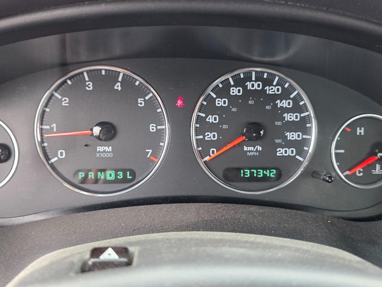 12733590