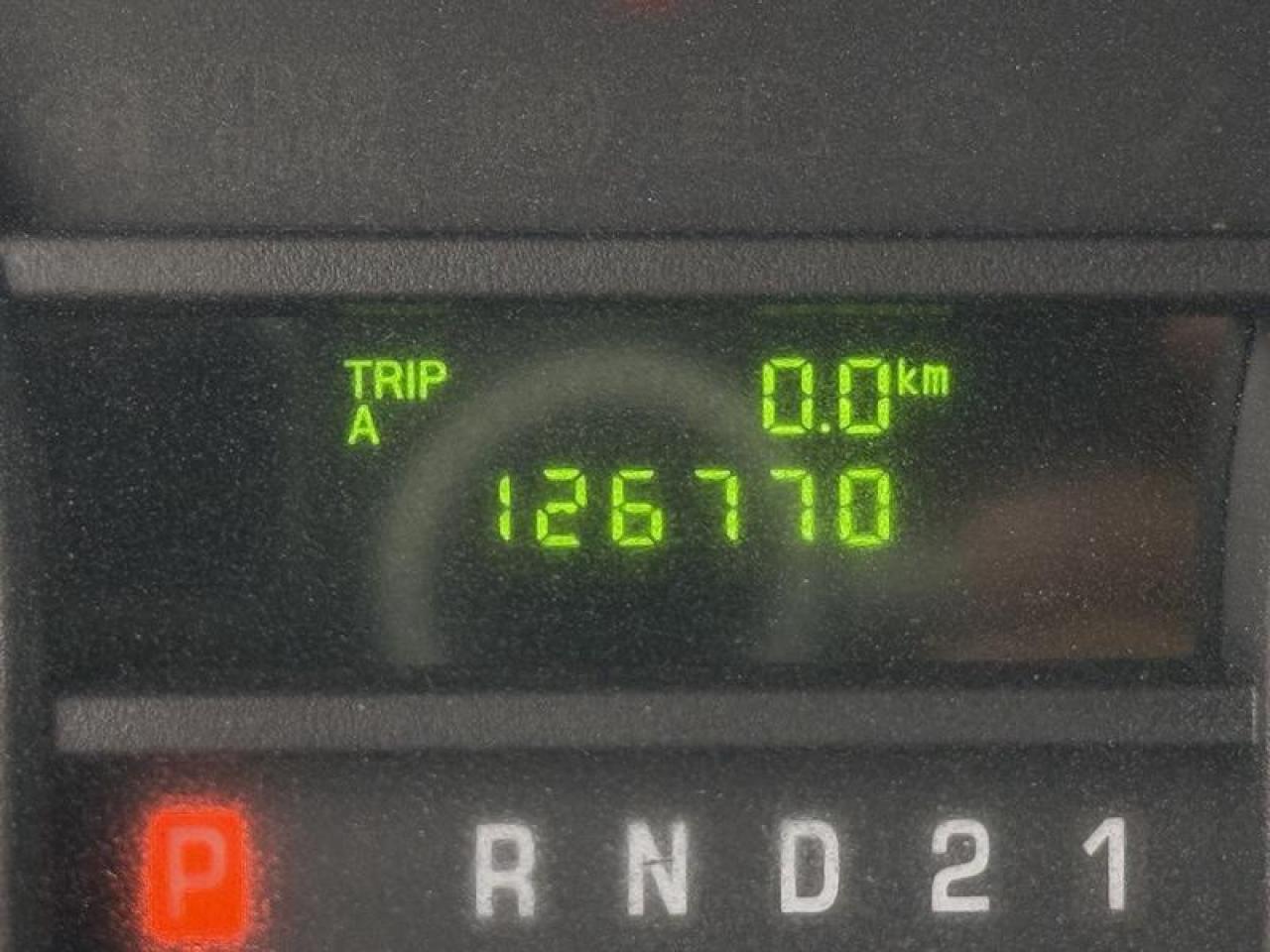 12737340