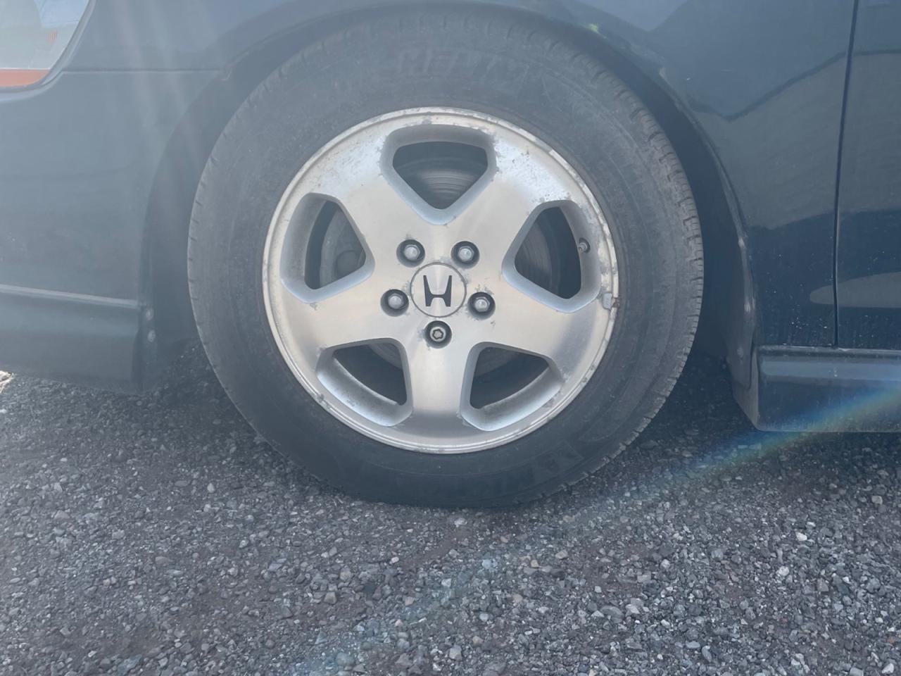 12742563