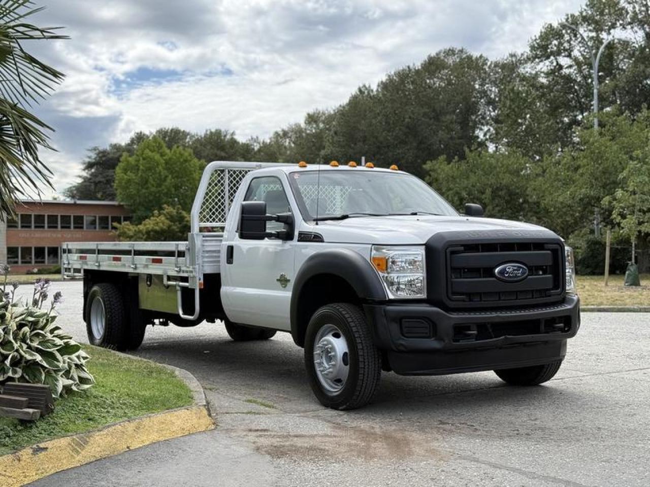Used 2016 Ford F-550 Regular Cab Dually Diesel 2WD 14-Foot Flatdeck Truck for sale in Burnaby, BC