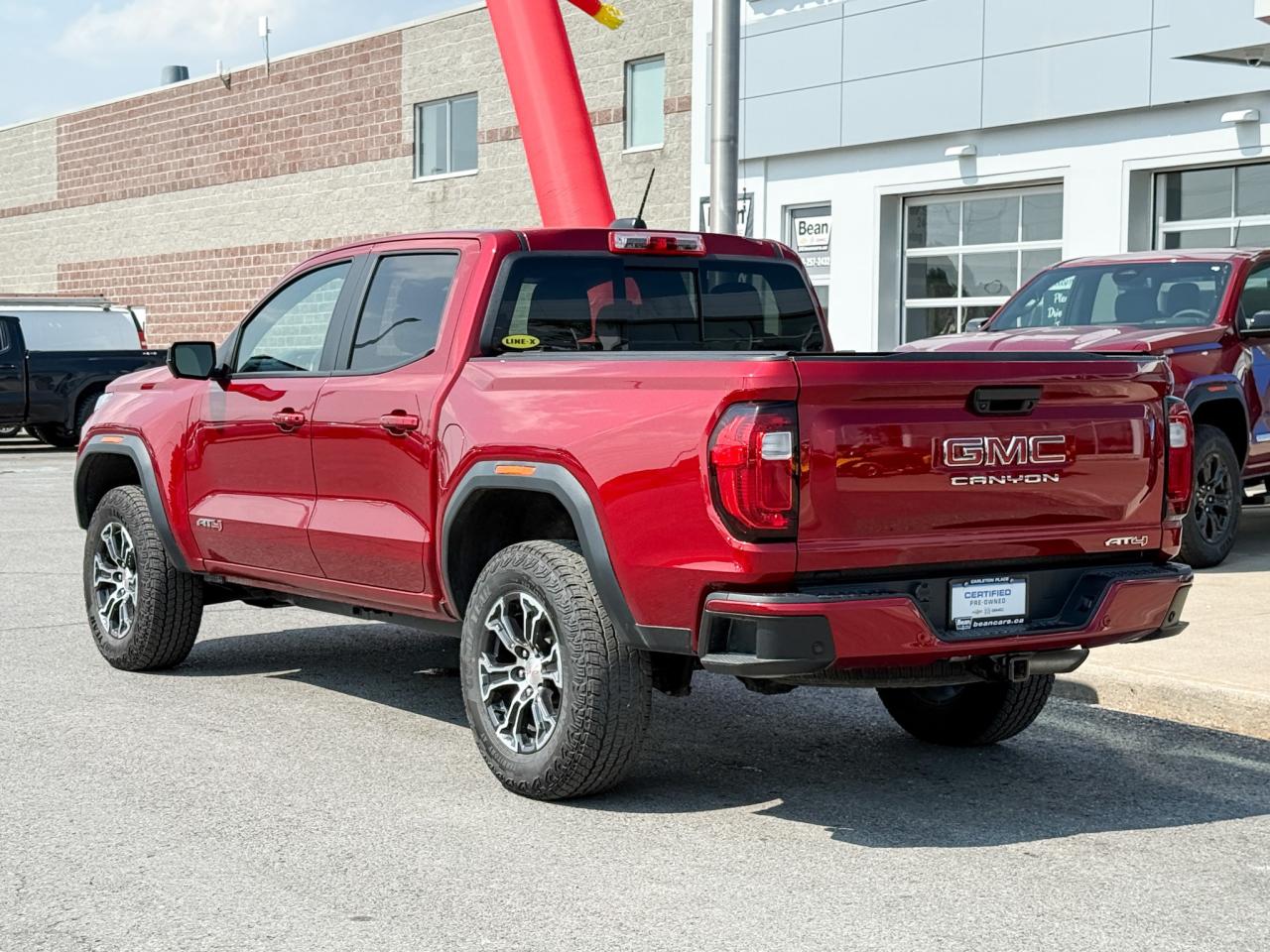 2024 GMC Canyon 2.7L 4CYL AT4 4X4 WITH OEM 2" FACTORY LIFT, HEATED LEATHER SEATS, HEATED STEERING WHEEL, REMOTE VEHICLE START, TRAILER BRAKE CONTROLLER Photo