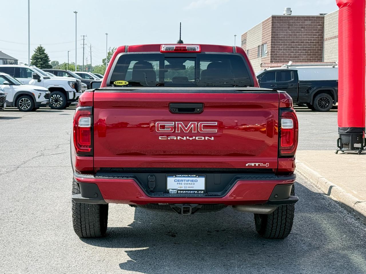 2024 GMC Canyon 2.7L 4CYL AT4 4X4 WITH OEM 2" FACTORY LIFT, HEATED LEATHER SEATS, HEATED STEERING WHEEL, REMOTE VEHICLE START, TRAILER BRAKE CONTROLLER Photo