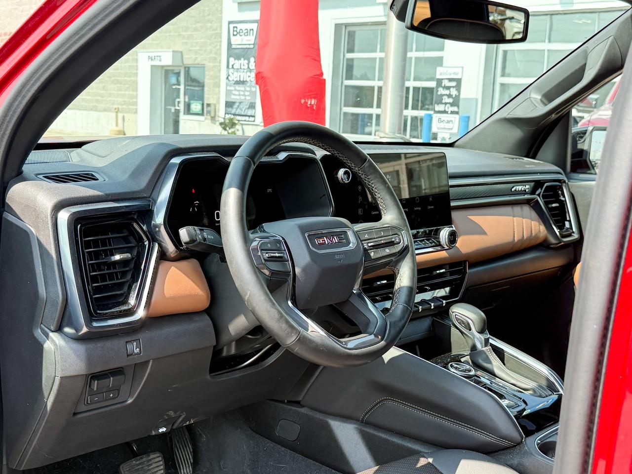 2024 GMC Canyon 2.7L 4CYL AT4 4X4 WITH OEM 2" FACTORY LIFT, HEATED LEATHER SEATS, HEATED STEERING WHEEL, REMOTE VEHICLE START, TRAILER BRAKE CONTROLLER Photo