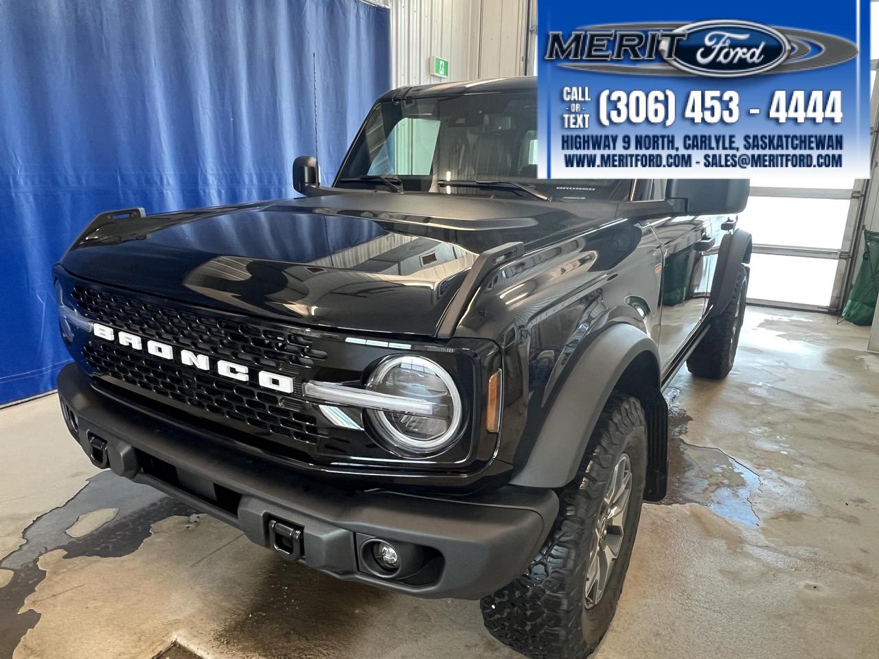 <p>Looking for adventure? Feast your eyes on this brand-new 2025 Ford Bronco Badlands, ready to conquer any terrain! This rugged SUV, available at Merit Ford Sales Ltd., is the ultimate blend of capability and style. With its bold Shadow Black exterior and a comfortable Black interior, this Bronco is designed to turn heads both on and off the road. Get ready to experience the freedom of open-air driving with its manual convertible top, perfect for soaking up the Canadian sunshine.</p><p>&nbsp;</p><p>This Bronco Badlands is packed with features to enhance your driving experience. Its equipped with advanced technology and safety features to keep you connected and protected. Whether youre navigating city streets or exploring the backcountry, this Bronco is your perfect companion.</p><p>&nbsp;</p><p>Here are five features that make this Bronco Badlands stand out:</p><p><br /><br /></p><ul><ul><li><strong>Connected Navigation:</strong> Stay on course with a one-year subscription to connected navigation, offering live traffic updates and predictive destinations.</li></ul></ul><p>&nbsp;</p><ul><ul><li><strong>Automatic Full-Time Four-Wheel Drive:</strong> Tackle any trail with confidence, knowing you have the power and control to navigate challenging terrain.</li></ul></ul><p>&nbsp;</p><ul><ul><li><strong>Ford Co-Pilot360:</strong> Drive with confidence with features like automatic high beams, blind spot information system, and collision mitigation.</li></ul></ul><p>&nbsp;</p><ul><ul><li><strong>Heated Leather Steering Wheel:</strong> Enjoy ultimate comfort with a heated leather steering wheel.</li></ul></ul><p>&nbsp;</p><ul><ul><li><strong>Back-Up Camera:</strong> Make parking and maneuvering a breeze with the help of the back-up camera.</li></ul></ul><p><br /><br /></p><p><strong><em>Powered by AutoIntelligence&trade;</em></strong><br />Vehicle information has been generated using artificial intelligence and is provided for informational purposes only. While efforts are made to ensure accuracy, please confirm all details directly with the dealer.</p><p>&nbsp;</p>
