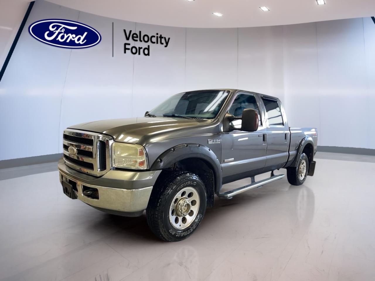 Experience uncompromising power and durability with the 2006 Ford Super Duty F-350 SRW XLT, now available at Velocity Ford in Moose Jaw. This robust truck features a grey exterior, a reliable 6-speed manual transmission, and advanced 4-wheel drive traction. With a commanding 6.0L OHV DI 32-valve V8 Turbo Diesel Power Stroke engine and 282,193 km on the odometer, its built for hard work and long hauls.

TRUCK FEATURES
»» 6.0L Turbo Diesel V8 for heavy-duty performance
»» 4-wheel drive for superior off-road capability
»» Impressive towing and payload capacities
»» Durable frame designed for demanding tasks

ADVANCED SAFETY FEATURES
»» Four-wheel anti-lock braking system for better control
»» Dual front airbags for driver and passenger
»» Daytime running lights for increased visibility
»» Side intrusion door beams for added protection

PERFORMANCE AND EFFICIENCY
»» 6-speed manual transmission for precise shifting
»» Turbocharged diesel engine for high torque output
»» Heavy-duty suspension for smooth load handling
»» 4-wheel drive enhances traction on tough terrain

COMFORT AND CONVENIENCE
»» Spacious crew cab with ample legroom
»» Air conditioning for year-round comfort
»» Power windows and door locks for convenience
»» Adjustable steering column for personalized driving

TECHNOLOGY AND CONNECTIVITY
»» AM/FM stereo system for entertainment
»» Easy-to-read instrument cluster
»» 12-volt power outlet for device charging
»» Pre-wired for trailer connections

CARGO SPACE
»» Large pickup bed for versatile hauling
»» Tie-down hooks to secure your load
»» Rear step bumper for easy access
»» Generous payload capacity for big jobs

WHAT OTHER OWNERS LIKE
»» Exceptional towing and hauling capabilities
»» Reliable diesel engine performance
»» Comfortable and spacious interior
»» Rugged build for demanding work environments


This 2006 Ford Super Duty F-350 SRW XLTs VIN is: 1FTWW31P96EB70438.