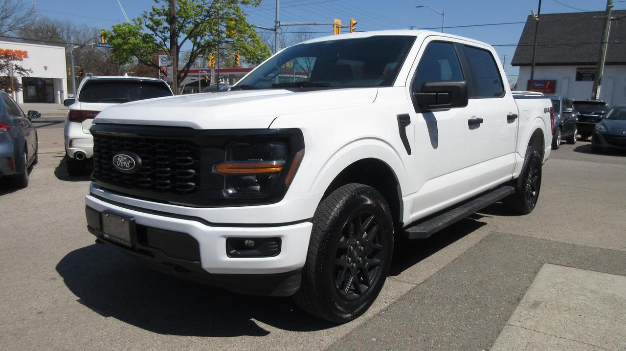 <p data-path-to-node=0><strong data-path-to-node=0 data-index-in-node=0>2024 Ford F-150 STX 4x4 &ndash; Oxford White &ndash; 24,700 KM</strong></p><p data-path-to-node=1><strong data-path-to-node=1 data-index-in-node=0>Description:</strong> Sharp, capable, and built to perform, this <strong data-path-to-node=1 data-index-in-node=56>2024 Ford F-150 STX 4x4</strong> offers premium style and advanced technology in a rugged, late-model package. Finished in classic <strong data-path-to-node=1 data-index-in-node=178>Oxford White</strong> over a refined <strong data-path-to-node=1 data-index-in-node=206>Black Sport Cloth</strong> interior, this crew cab stands out for its exceptional condition, aggressive stance, and incredible value.</p><p data-path-to-node=2>With only <strong data-path-to-node=2 data-index-in-node=10>24,700 km</strong> and a <strong data-path-to-node=2 data-index-in-node=26>Clean Carfax</strong> (no accidents), this truck is nearly new and ready for work or play. It features the highly desirable <strong data-path-to-node=2 data-index-in-node=141>STX Black Appearance Package</strong>, giving it a custom look straight from the factory with gloss black accents and upgraded wheels.</p><p data-path-to-node=3><strong data-path-to-node=3 data-index-in-node=0>Pricing & Transparency:</strong></p><ul data-path-to-node=4><li><p data-path-to-node=4,0,0><strong data-path-to-node=4,0,0 data-index-in-node=0>Certified:</strong> This vehicle is sold fully certified following a comprehensive safety inspection.</p></li><li><p data-path-to-node=4,1,0><strong data-path-to-node=4,1,0 data-index-in-node=0>All-In Pricing:</strong> Our price includes the <strong data-path-to-node=4,1,0 data-index-in-node=39>Admin Fee</strong> and <strong data-path-to-node=4,1,0 data-index-in-node=53>OMVIC fee</strong>.</p></li><li><p data-path-to-node=4,2,0><em data-path-to-node=4,2,0 data-index-in-node=0>Note: Price is plus HST and Licensing.</em></p></li></ul><p data-path-to-node=5><strong data-path-to-node=5 data-index-in-node=0>Performance & Capability:</strong></p><ul data-path-to-node=6><li><p data-path-to-node=6,0,0><strong data-path-to-node=6,0,0 data-index-in-node=0>Drivetrain:</strong> 4x4 with Hill Start Assist and Curve Control.</p></li><li><p data-path-to-node=6,1,0><strong data-path-to-node=6,1,0 data-index-in-node=0>Fuel Capacity:</strong> Upgraded <strong data-path-to-node=6,1,0 data-index-in-node=24>136-Litre (36-Gallon)</strong> extended-range fuel tank.</p></li><li><p data-path-to-node=6,2,0><strong data-path-to-node=6,2,0 data-index-in-node=0>Towing:</strong> Class IV Trailer Hitch with Trailer Sway Control and a fully boxed high-strength steel frame.</p></li><li><p data-path-to-node=6,3,0><strong data-path-to-node=6,3,0 data-index-in-node=0>GVWR:</strong> 6,650 lb package, engineered for heavy-duty utility.</p></li></ul><p data-path-to-node=7><strong data-path-to-node=7 data-index-in-node=0>Key Build Options & Features:</strong></p><ul data-path-to-node=8><li><p data-path-to-node=8,0,0><strong data-path-to-node=8,0,0 data-index-in-node=0>STX Black Appearance Package:</strong> Includes 20 Gloss Black Aluminum wheels, black grille, and unique black trim accents.</p></li><li><p data-path-to-node=8,1,0><strong data-path-to-node=8,1,0 data-index-in-node=0>Technology:</strong> 12-inch SYNC 4 touchscreen with Enhanced Voice Recognition and FordPass Connect.</p></li><li><p data-path-to-node=8,2,0><strong data-path-to-node=8,2,0 data-index-in-node=0>Safety:</strong> Ford Co-Pilot360 suite featuring BLIS (Blind Spot Information System) with Cross-Traffic Alert, Lane-Keeping System, and Pre-Collision Assist with AEB.</p></li><li><p data-path-to-node=8,3,0><strong data-path-to-node=8,3,0 data-index-in-node=0>Convenience:</strong> Rear-view camera with reverse sensing, tray-style bed liner, and power-adjustable mirrors/locks.</p></li><li><p data-path-to-node=8,4,0><strong data-path-to-node=8,4,0 data-index-in-node=0>Interior:</strong> Durable and comfortable black cloth seating with matching carpet mats.</p></li></ul><p data-path-to-node=9><strong data-path-to-node=9 data-index-in-node=0>Warranty:</strong></p><ul data-path-to-node=10><li><p data-path-to-node=10,0,0>Remainder of the Ford Factory Warranty is valid and transferable.</p></li></ul><p data-path-to-node=11><strong data-path-to-node=11 data-index-in-node=0>Location:</strong> Mississauga, ON <strong data-path-to-node=11 data-index-in-node=26>Contact:</strong> 905-823-5535 | sales@mac.ca</p>