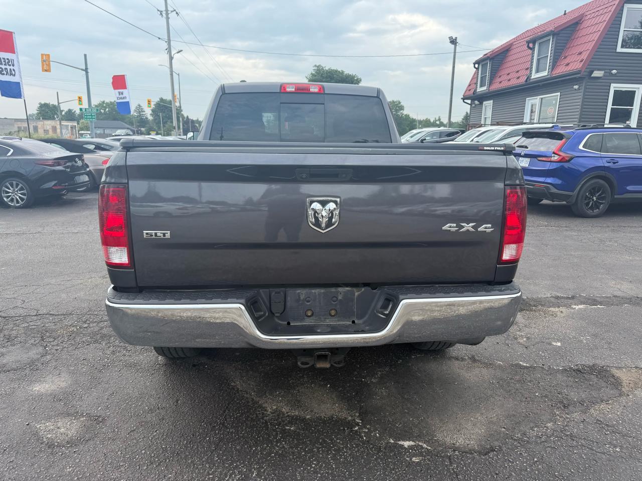 2015 RAM 1500 4WD Quad Cab SLT Photo4