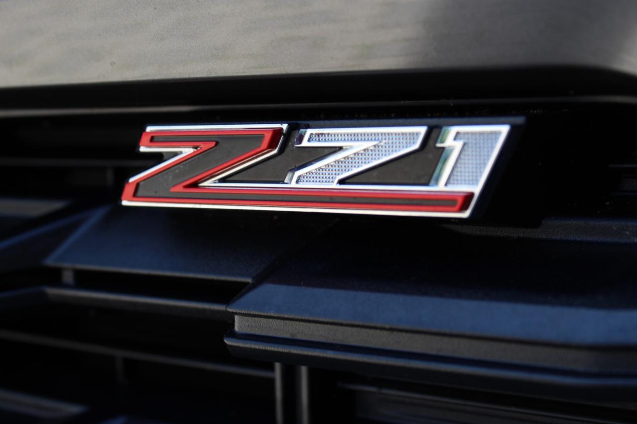 12771557