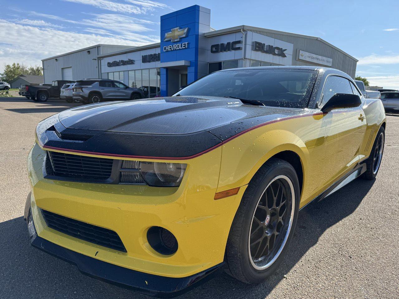 Our 2010 Chevrolet Camaro 2SS Coupe will make your pulse race in Yellow! Powered by a 6.2 Litre V8 offering 400hp connected to a 6 Speed Automatic transmission designed to jet you to 60mph in seconds. This coupe delivers an exhilarating ride and rewards you with nearly approximately 9.4L/100km on the highway while showing off fog lamps, great-looking SS exclusive alloy wheels, and a rear spoiler to enhance the sporty athletic exterior. Our 2SS trim will take you back to your youth or help you draw the path for the person you will become. Luxurious leather seating, heated front seats, a premium sound system, and more are waiting for you in this solid-performing muscle car! Youll fall in love with the high-tech safety equipment on our Chevrolet. Ultrasonic rear parking assist, a tire pressure monitoring system, and a fleet of airbags will keep you secure. So dont wait any longer and take this 2SS Camaro Coupe home! Get down here and take home the car of your dreams! Save this Page and Call for Availability. We Know You Will Enjoy Your Test Drive Towards Ownership!