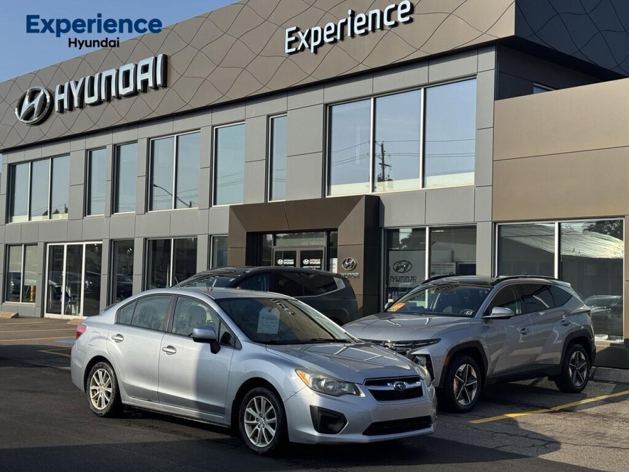 This vehicle exudes quality! You cant go wrong with this reliable 2014 Subaru Impreza. Side Impact Beams, Rear Child Safety Locks, Outboard Front Lap And Shoulder Safety Belts -inc: Rear Centre 3 Point, Height Adjusters and Pretensioners, Electronic Stability Control (ESC), Dual Stage Driver And Passenger Seat-Mounted Side Airbags. 
 
 This Subaru Impreza Passed the Test! 
 IIHS Top Safety Pick, KBB.com Best Resale Value Awards, KBB.com 10 Best All-Wheel Drive Cars & SUVs Under $25,000. 
 
 The Experts Verdict...
 As reported by KBB.com: If you live where snow, rain and ice are commonplace occurrences, the logical choice for compact-car shoppers is the 2014 Subaru Impreza. It offers excellent year-round traction, good fuel economy, and in WRX form, impressive performance for less than $30,000. 
 
Fully-Loaded with Additional Options
Variable Intermittent Wipers w/Heated Wiper Park, Valet Function, Urethane Gear Shifter Material, Trunk Rear Cargo Access, Trip Computer, Strut Front Suspension w/Coil Springs, Steel Spare Wheel, Single Stainless Steel Exhaust, Side Impact Beams, Seats w/Cloth Back Material.
 
 Visit Us Today 
 Stop by Experience Hyundai located at 15 Mount Edward Rd, Charlottetown, PE C1A 5R7 for a quick visit and a great vehicle!
 Were PEIs Premier Credit Specialists! Good poor, bad, or new credit? Divorced? Self-Employed? We have you covered! Our Credit Specialists are on standby 24/7 to help get you behind the wheel today! APPLY FOR YOUR PRE-APPROVAL TODAY - https://www.steeleadvantagefinancing.com/7182