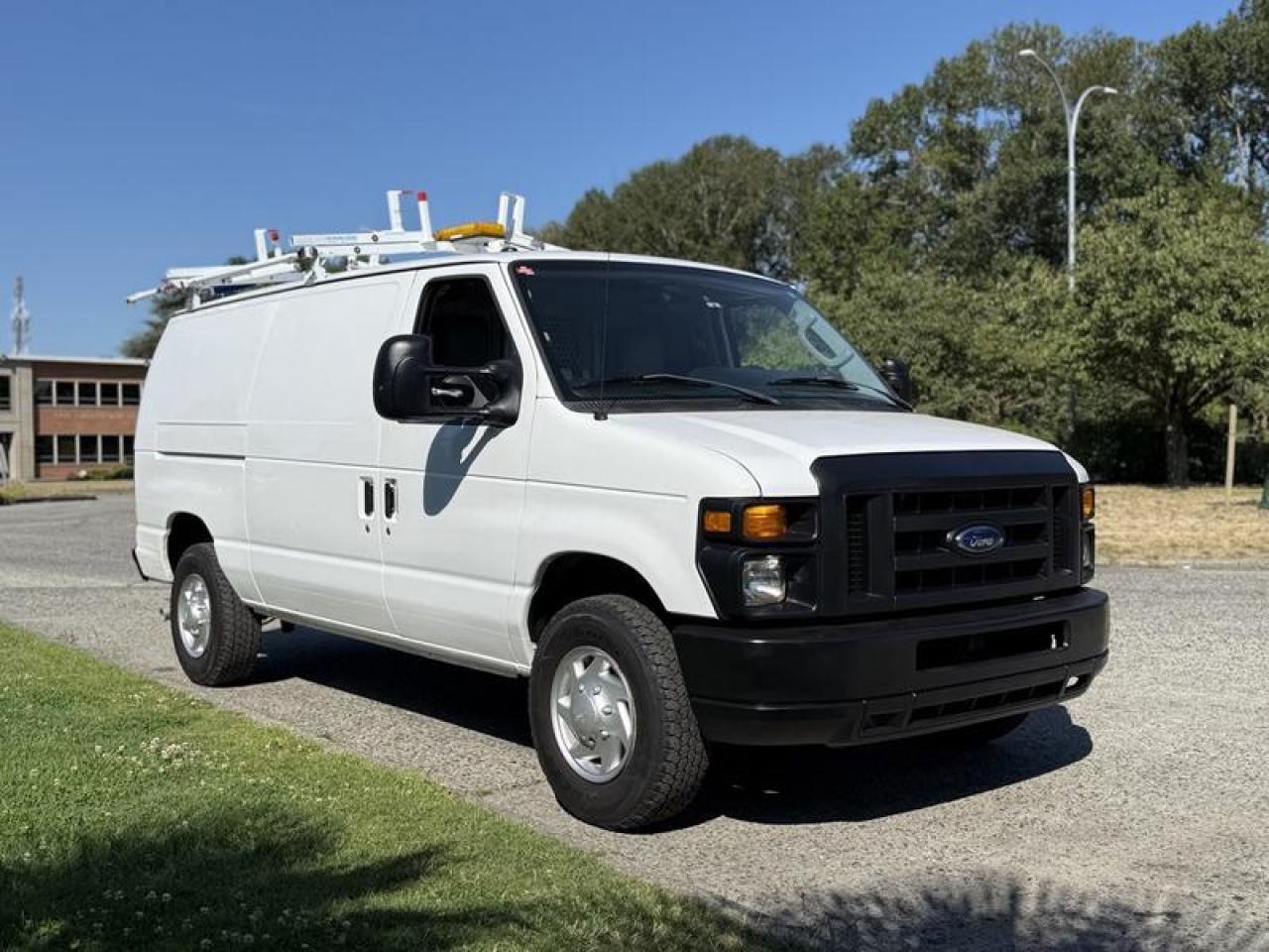 Used 2011 Ford Econoline E-350 Super Duty Cargo Van with Shelving & Ladder Rack for sale in Burnaby, BC