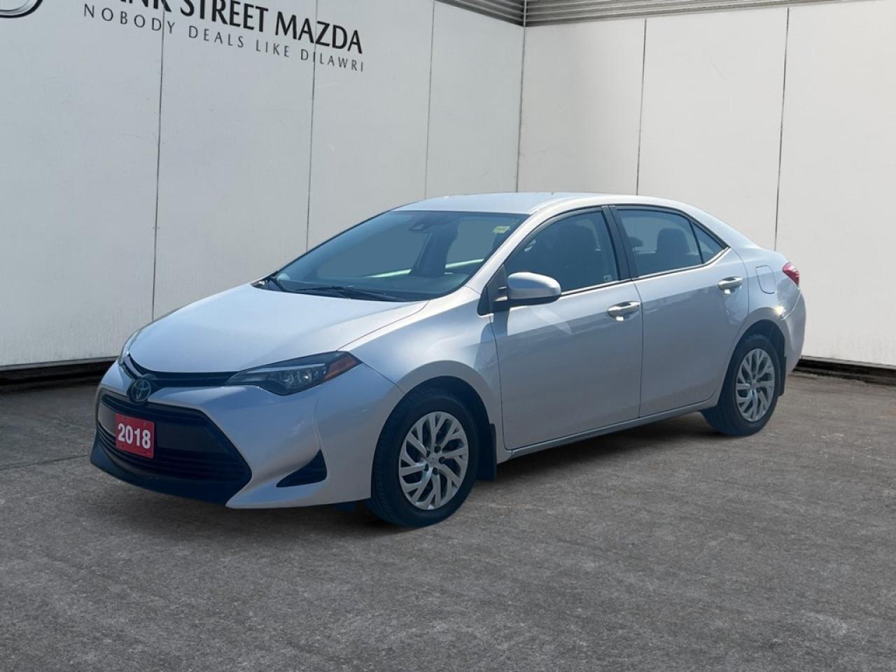 The 2018 Toyota Corolla LE CVT in a sophisticated silver finish with FWD provides seamless handling making every drive enjoyable. This sedan, with its automatic transmission and 1.8L 4-cylinder engine, offers both efficiency and reliability. Its exterior exudes timeless style, complemented by a sleek design that catches every eye. Inside, the Corolla LE CVT features power windows, enhancing your comfort and convenience on every journey. The thoughtfully designed interior ensures a pleasant driving experience, whether youre navigating busy city streets or embarking on a road trip. This vehicle is equipped with essential technology such as a backup camera and Bluetooth connection, keeping you connected and ensuring peace of mind. It also incorporates key safety features including brake assist, cruise control, and lane assist, which aid in maintaining driver safety during every trip. This Toyota Corolla is an ideal choice for individuals seeking a reliable and stylish vehicle with modern conveniences. Contact our dealership today to learn more about how this impeccable sedan can meet your driving needs.