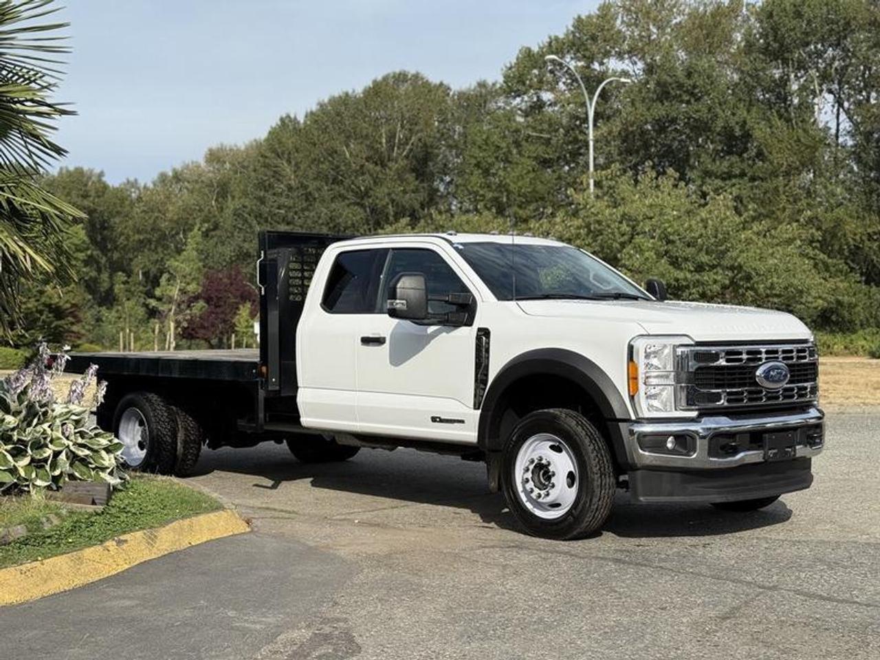 2023 Ford F-550 XLT SuperCab 12-Foot Flat Deck Truck 4x4 Diesel, 6.7L, 8 cylinder, 4 door, automatic, 4WD, cruise control, air conditioning, AM/FM radio, power door locks, power windows, power mirrors, white exterior, grey interior, cloth. 12 x 8 deck, Bluetooth, exhaust brake, power seats, heated seats, 4x4 selector, trailer package, power pedal adjustment, electronic parking brake, AUX switches. Certification and decal valid until October 2025. This item is currently OFFSITE. You must register an appointment with our office to schedule an offsite viewing. Appointments must be made a minimum of one business day in advance (and as defined by the days that Repo.com is open for business) before your appointment can be scheduled and confirmed. We may, at our own discretion, instead opt to transport smaller items to Repo.coms main yard for viewing purposes.  $85,880.00 plus $375 processing fee, $86,255.00 total payment obligation before taxes.   Listing report, warranty, contract commitment cancellation fee, financing available on approved credit (some limitations and exceptions may apply). All above specifications and information is considered to be accurate but is not guaranteed and no opinion or advice is given as to whether this item should be purchased. We do not allow test drives due to theft, fraud, acts of vandalism and undetectable impaired driving. Instead we provide the following benefits: Complimentary Warranty (with options to extend), Limited Money Back Satisfaction Guarantee on Fully Completed Contracts, Contract Commitment Cancellation, and an Open-Ended Sell-Back Option. Ask seller for details or call 604-522-REPO(7376) to confirm listing availability.