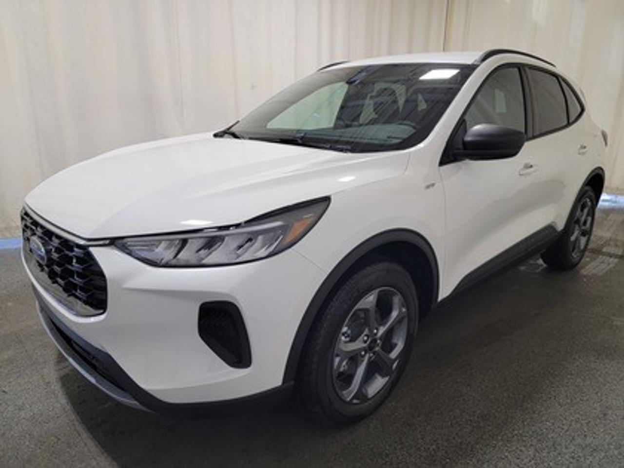 This all-new 2025 Escape ST-Line 300A looks absolutely stunning in Star White Metallic. This 5-passenger all-wheel drive crossover is equipped with the 1.5L EcoBoost® engine. This remarkable engine not only produces 181 horsepower and 190 ft-lbs of torque, but by leveraging EcoBoost® technology and an 8-speed automatic transmission, this crossover is rated to get an estimated 8.4L/100km (34 miles per gallon) combined highway/city fuel economy.

This vehicle comes with the All-Weather Packageready to take on any season! 

Snow, rain, mud, or sunshinethis vehicle is built for it all! The All-Weather Package adds extra protection where it matters most, with premium mud flaps to shield your paint from road debris, all-weather floor mats to protect your interior from lifes messes, and Xpel paint protection to help guard against those infuriating rock chips. Drive with confidence, knowing your investment is protected from Regina's elements. 

Key Features:
Power Liftgate
All-Wheel Drive
Heated Front Seats
Heated Premium Wrapped Sport Steering Wheel
Heated Mirrors
Remote Start
18 Rock Metallic Painted Aluminum Wheels
8-Way Power Driver Seat
Power Windows
LED Headlamps
LED Taillamps
Ford Co-Pilot360
SYNC® 4 W/8 LCD Capacitive Touchscreen
Wireless Apple CarPlay® and Android Auto Compatibility
Mini Spare Wheel/Tire

Snow, rain, mud, or sunshinethis vehicle is built for it all! The All-Weather Package adds extra protection where it matters most, with premium mud flaps to shield your paint from road debris, all-weather floor mats to protect your interior from lifes messes, and Xpel paint protection to help guard against those infuriating rock chips. Drive with confidence, knowing your investment is protected from Regina's elements.

Bennett Dunlop Ford, proudly serving Regina for over 40 years, is conveniently located at 770 Broad Street. With over 3,500 Google reviews, our reputation reflects our commitment to providing a fast, easy, and enjoyable vehicle-buying experience. We eliminate the hassle with no admin or documentation fees, transparent upfront pricing lets you shop with total confidence. But were more than just a dealershipwere driven to make a difference by supporting local community initiatives and events that matter to you. Visit Bennett Dunlop Ford today and experience why were Reginas trusted choice for quality vehicles, exceptional service, and a genuine commitment to driving change in our community!