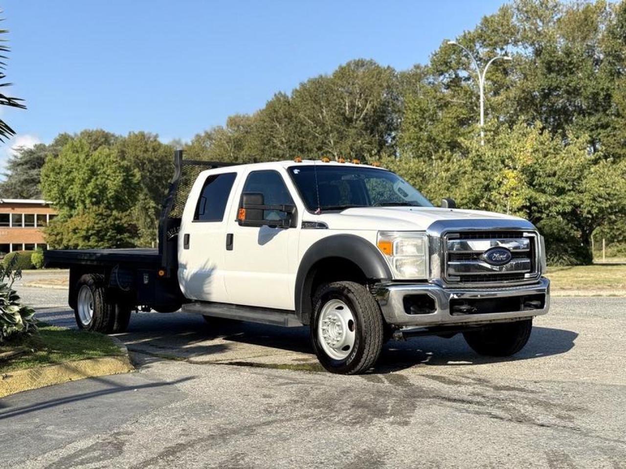 Used 2014 Ford F-550 Super Duty 4x4 Crew Cab 11-Foot Flat Deck Truck for sale in Burnaby, BC