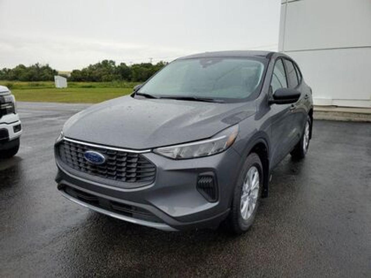This all-new 2025 Escape Active 200A looks absolutely stunning in Carbonized Gray Metallic. This 5-passenger All-wheel drive crossover comes equipped with the 1.5L EcoBoost® engine. This remarkable engine not only produces 181 horsepower and 190 ft-lbs of torque, but by leveraging EcoBoost® technology and an 8-speed automatic transmission, this crossover is rated to get an estimated 8.4L/100km (34 miles per gallon) combined highway/city fuel economy.

Key Features:
8 Instrument panel cluster
 All-wheel drive
Ford Co-Pilot360
Heated Front Seats
Remote Start
Heated Mirrors
SYNC® 4 W/8 LCD Capacitive Touchscreen
Wireless Apple CarPlay® and Android Auto Compatibility
Privacy Glass
17 Shadow Silver Painted Aluminum Wheels
Power Windows
LED Taillamps
LED Headlamps
FordPass Connect
Mini Spare Wheel/Tire

Moose Jaw Ford, conveniently located at 1010 North Service Road in Moose Jaw, is your trusted destination for all your automotive needs. With an impressive 4.8-star Google rating from nearly 1,500 reviews, we are proud to deliver an exceptional vehicle-buying experience tailored just for you. Our Moose Jaw Motives set us apart, offering unbeatable value like half-priced oil changes for life on pre-owned vehicles, one year of key and remote protection, and one year of tire and rim protection. Enjoy peace of mind with every purchase. At Moose Jaw Ford, were committed to driving positive change in our community by combining exceptional service, high-quality vehicles, and a guest-first approach. Visit us today!