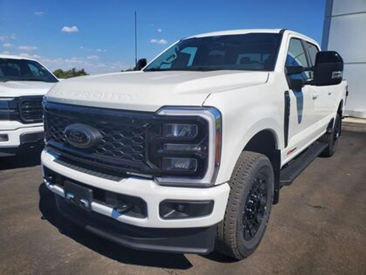 This all new 2026 Ford F-350 Lariat Crew Cab 4X4 618A looks absolutely stunning in Star White Metallic. This heavy duty picks up comes with the 6.7L Power Stroke Diesel engine. This remarkable engine not only produces 475 horsepower and 1,050 ft pounds of torque, but by leveraging technology and a 10-speed automatic transmission. This truck can tow up to a massive amount of 20,000 pounds!

Key Features:

This 2026 F-350 Lariat is a built Ford tough truck that leverages physical features and technology that helps you get the job done and enjoy doing it! This specific unit is loaded right up and includes power windows, power locks, air conditioning, power drivers seat, zone lighting, dynamic brake support, outside temperature display, hill start assist, perimeter safety system, four-wheel drive, and so much more. 

Ford Connectivity Package 
12 Productivity Screen  
LED Box Lighting
Driver Memory Seat System
Heated Front Seats
Heated Steering Wheel
Ford Co-Pilot360 Technology 
360 Degree Camera
Rain Sensing Wipers 
B&O Sound System
Rear Parking Sensors 
Intelligent Access W/ Push Button Start 
Apple CarPlay & Android Auto Compatibility 
Cruise Control 
Remote Keyless Entry
Black Appearance Package 
  -LT275/65R20E BSW All Terrain
  -Rear Wheel Well Liners 
  -20 Gloss Black Painted Wheels
  -Tough Bed Spray In Liner
FX4 Off Road Package 
 -Skid Plates
Power Sliding Rear Window
5th Wheel/Gooseneck Hitch Prep
Twin Panel Moonroof
Activex Trim

The 2026 Super Duty is the backbone of Saskatchewans worksites, built for hauling, towing, and powering through demanding days. The Super Duty makes moving heavy equipment and navigating tight job sites easier and safer. Inside, the cab is designed as a mobile command center with SYNC® 4 technology, large digital displays, and generous storage for tools and gear. Rugged materials, advanced safety systems, keep crews comfortable and productive from the first load to the final shift.

Moose Jaw Ford, conveniently located at 1010 North Service Road in Moose Jaw, is your trusted destination for all your automotive needs. With an impressive 4.8-star Google rating from nearly 1,500 reviews, we are proud to deliver an exceptional vehicle-buying experience tailored just for you. Our Moose Jaw Motives set us apart, offering unbeatable value like half-priced oil changes for life on pre-owned vehicles, one year of key and remote protection, and one year of tire and rim protection. Enjoy peace of mind with every purchase. At Moose Jaw Ford, were committed to driving positive change in our community by combining exceptional service, high-quality vehicles, and a guest-first approach. Visit us today!