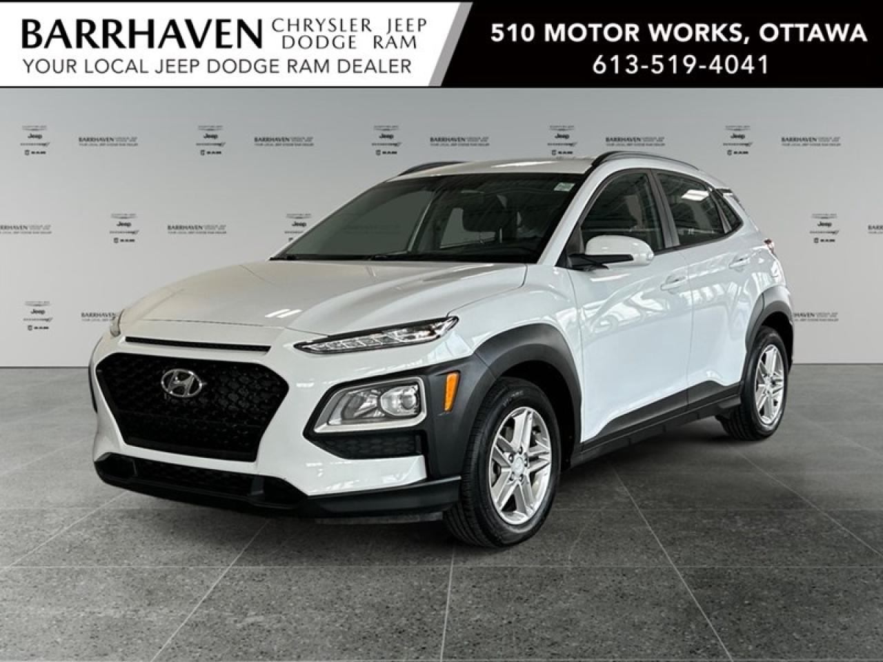 The 2019 Hyundai Kona Essential in classic white offers a smooth and agile drive with its front-wheel-drive system. The handling is perfect for urban adventures and weekend getaways, giving you confidence on the road. The exterior of this SUV is accentuated by stylish alloy wheels that enhance its appeal, while heated mirrors are a great touch for tackling inclement weather. Inside, the space is thoughtfully designed with comfort in mind, featuring heated front seats and a user-friendly smart device integration system to keep you connected on the go. Stay entertained and informed with Bluetooth connection and a backup camera that ensures safety while parking. Additionally, enjoy peace of mind with features like cruise control, brake assist, and keyless entry, making every journey seamless and secure. This Hyundai Kona is perfect for those who seek functionality and style in their everyday drive. Its a great choice for families, city dwellers, or anyone who values efficiency without sacrificing comfort and technology. Contact our dealership today for more details and make this versatile SUV yours!
