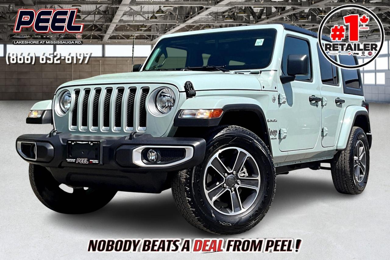 COME SEE WHY NOBODY BEATS A DEAL FROM PEEL! Your Source for ALL make and models used cars and trucks. Canadas #1 Stellantis Retailer for 9 years & counting!!

2023 Jeep Wrangler 4 Door Sahara 4X4 | 3.6L V6 w/ eTorque | Earl Exterior | Heated Cloth Bucket Seats | Uconnect 4C NAV w/ 8.4" Display | Apple CarPlay & Android Auto | Alpine Premium Audio System | Heated Steering Wheel | Remote Start | Trailer Tow Group | 2.72:1 Selec-Trac Part-time 4X4 System | Jeep Wave Customer Care

One Owner Clean Carfax

Stand out on every adventure with this 2023 Jeep Wrangler Sahara 4-Door 4X4, finished in the unique and eye-catching Earl exterior and powered by the 3.6L V6 with eTorque for added efficiency and smooth performance. Inside, heated cloth bucket seats, a heated steering wheel, and remote start keep you comfortable in any season, while the Uconnect 4C NAV with 8.4-inch display, Apple CarPlay, Android Auto, and the Alpine Premium Audio System deliver seamless connectivity and premium sound. Built for capability, it features the Trailer Tow Group, 2.72:1 Selec-Trac part-time 4X4 system, and legendary Jeep engineering for confident handling on and off the road. Backed by Jeep Wave Customer Care and a One Owner Clean Carfax, this Sahara offers the perfect blend of distinctive style, advanced tech, and true Jeep versatility.
______________________________________________________

Engage & Explore with Peel Chrysler: Whether youre inquiring about our latest offers or seeking guidance, 1-866-652-6197 connects you directly. Dive deeper online or connect with our team to navigate your automotive journey seamlessly.

WE TAKE ALL TRADES & CREDIT. WE SHIP ANYWHERE IN CANADA! OUR TEAM IS READY TO SERVE YOU 7 DAYS!
______________________________________________________
Our advertised prices are for consumers (i.e end users) only.

*FREE CarFax (click the link above to check it out at no cost to you!)*

*FULLY CERTIFIED! (Have you seen some of these other dealers stating in their advertisements that certification is an additional fee? NOT HERE! Our certification is already included in our low sale prices to save you more!)

______________________________________________________

Peel Chrysler  A Trusted Destination: Based in Port Credit, Ontario, we proudly serve customers from all corners of Ontario and Canada including Toronto, Oakville, North York, Richmond Hill, Ajax, Hamilton, Niagara Falls, Brampton, Thornhill, Scarborough, Vaughan, London, Windsor, Cambridge, Kitchener, Waterloo, Brantford, Sarnia, Pickering, Huntsville, Milton, Woodbridge, Maple, Aurora, Newmarket, Orangeville, Georgetown, Stouffville, Markham, North Bay, Sudbury, Barrie, Sault Ste. Marie, Parry Sound, Bracebridge, Gravenhurst, Oshawa, Ajax, Kingston, Innisfil and surrounding areas. On our website www.peelchrysler.com, you will find a vast selection of new vehicles including the new and used Ram 1500, 2500 and 3500. Chrysler Grand Caravan, Chrysler Pacifica, Jeep Cherokee, Wrangler and more. All vehicles are priced to sell. We deliver throughout Canada. website or call us 1-866-652-6197.

Disclaimer Statement: At Peel Chrysler, your satisfaction is our priority. While many pre-owned vehicles originally come with two keys, variations may occur based on trade-ins, and all Peel Chrysler Pre-Owned Vehicles come standard with one keyany extras provided by the previous owner will be included with your purchase, and additional keys can be bought at the time of sale. Online prices and payments are for finance purchases. Used vehicles that are being financed are subject to a $499 (^$1500 non-prime) financing fee, while cash purchases (certified cheque, bank draft, or wire transfer) on used vehicles have a $2,000 surcharge ( online price + $2,000). Cash purchases of new vehicles only incur applicable taxes and licensing fees, and those priced above $100,000 (including accessories or add-ons) are subject to a federal luxury tax. Optional finance and lease terms are available, and if trading in a vehicle with an outstanding loan balance requiring Peel Chrysler to facilitate the lien payout, a Lien Payout Fee of $349 applies. Prices, rates, and payments are subject to change without notice. While we strive for accuracy, occasional technical or human errors may occur, so we encourage verifying all vehicle details, including features, options, materials, and specifications, with a Peel Chrysler representative by contacting us or visiting our dealership. Experience seamless convenience with our nationwide delivery options. Visit our website or contact us for more details.