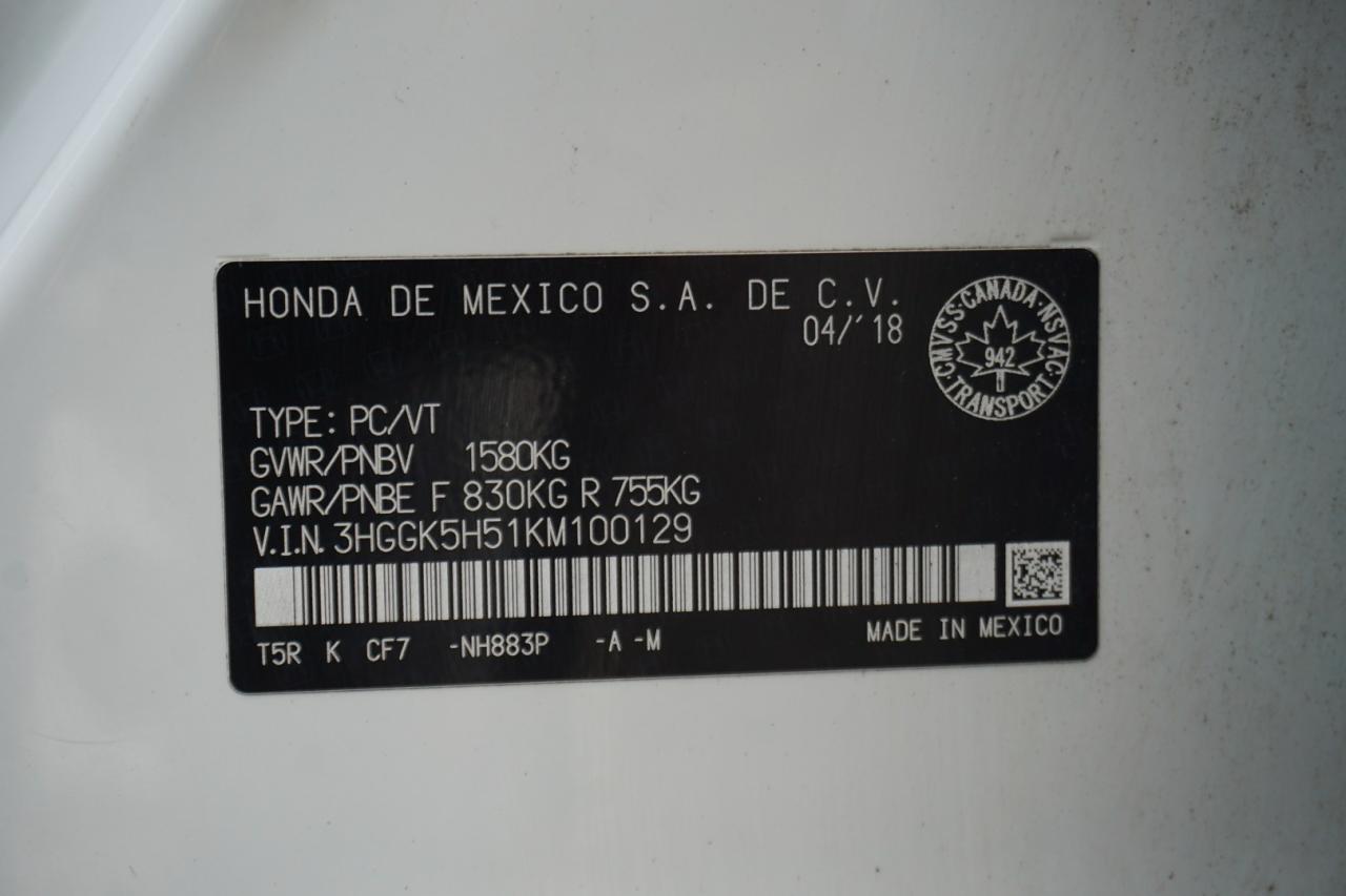 12857702
