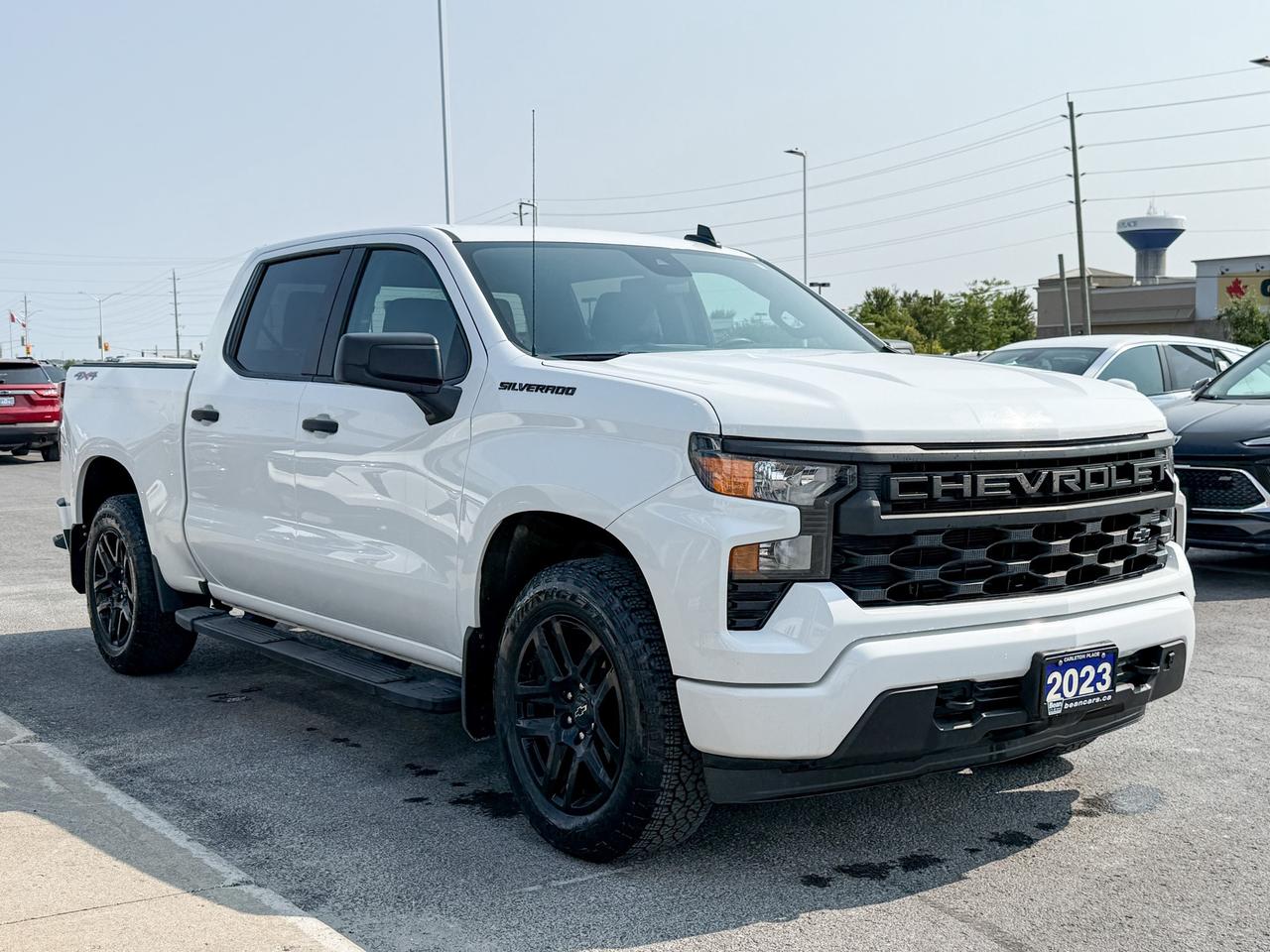 2023 Chevrolet Silverado 1500 Custom CLEAN CARFAX, 2.7L 4CYL TURBOMAX, CREW CAB SHORT BOX CUSTOM 4X4, TRAILERING PACKAGE, BLACK OUT PACKAGE, 6" BLACK SIDE STEPS, 20" GLOSS BLACK ALLOY WHEELS, REAR VISION CAMERA Photo