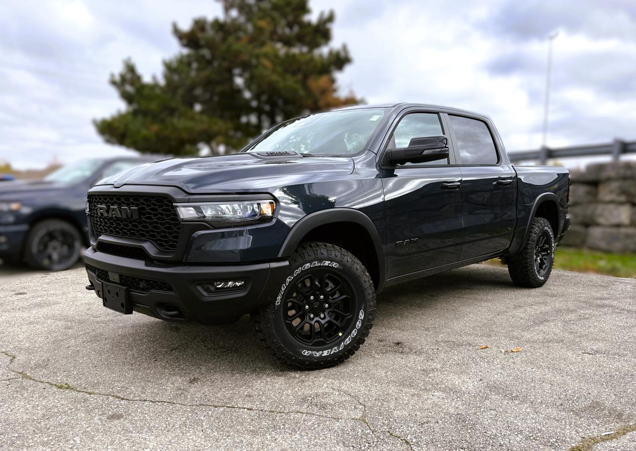 Additional $998 will be charged for dealer installed running boards  With rugged hardware and trail-tuned confidence, our New 2026 RAM 1500 Rebel Crew Cab 4X4, equipped with the Level 2 Equipment Package in Forged Blue Metallic, dares you to push past your limits. Motivated by a Twin-TurboCharged 3.0 Litre Hurricane 6 Cylinder delivering 420hp to an 8 Speed Automatic transmission engineered for off-road domination. A raised ride height, performance shocks, and a shift-on-demand transfer case can take this Four Wheel Drive truck further down the trail, and it achieves approximately 9.8L/100km on the highway. Our fierce and stylish RAM features LED lighting, fog lamps, a sport performance hood, bold graphics, alloy wheels, off-road fender flares, and robust skid plates.  Our Rebel cabin is ready for rough terrain, thanks to its Level 2 Equipment Pack, which features heated/ventilated luxury leather front seats, eight-way power adjustment for the driver, heated rear seats, a heated-wrapped steering wheel, dual-zone automatic climate control, 12V/115V outlets, a power rear window, and remote start. Off-Road Info Pages enhance the infotainment system with Uconnect&reg; 5 14.4-inch touchscreen display, full-color navigation, WiFi compatibility, Android Auto&reg;/Apple CarPlay&reg;, Bluetooth&reg;, voice control, dual wireless charging, and a nineteen-speaker Harman Kardon&reg; audio sound system.  For safetys sake, RAM supplies front/rear auto braking, blind-spot monitoring, adaptive cruise control, active lane management, trailer sway damping, hill-start assistance, and more. Committed to truck leadership, our 1500 Rebel is a compelling choice! Save this Page and Call for Availability. We Know You Will Enjoy Your Test Drive Towards Ownership!