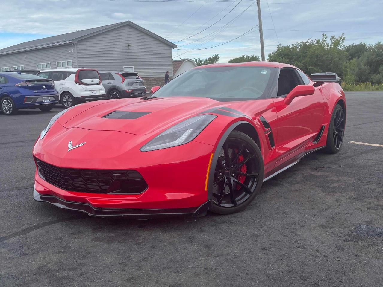 Recent Arrival! 2019 Chevrolet Corvette Grand Sport 2LT | Sports Car | Zacks Certified. 8 Speed Paddle Shift with Automatic Modes RWD Torch Red 6.2L V8<br />Experience true performance with the 2019 Corvette Grand Sport 2LT, equipped with a 6.2L V8 engine paired to a smooth-shifting 8-speed automatic transmission. With 460 horsepower, performance exhaust, and magnetic ride control, it delivers sharp cornering and thrilling acceleration.<br /><br />The 2LT trim offers elevated comfort with heated and ventilated leather seats, a Bose premium sound system, head-up display, navigation, and a performance data recorder. Its aggressive wide-body design and track-inspired features make it stand out from every angle.<br /><br />A perfect blend of American muscle and everyday luxurythe Grand Sport 2LT is ready for the road or the track.<br /><br />8-Way Driver & Passenger Seat Adjusters, Adaptive suspension, Air Conditioning, AM/FM radio: SiriusXM, Apple CarPlay/Android Auto, Auto-Dimming Inside Frameless Rearview Mirror, Automatic temperature control, Bose Advanced 10-Speaker Audio System Feature, Bose Premium 9-Speaker Audio System Feature, Cargo Net, Exterior Parking Camera Rear, Front Curb View Cameras, Fully automatic headlights, GT Bucket Seats, Head-Up Display, Heated & Vented Driver & Front Passenger Seats, Leather Shift Knob, Leather steering wheel, Luggage Shade, Memory Package, Navigation System, Power Lumbar/Bolster Seat Adjusters, Power windows, Preferred Equipment Group 2LT, Rear window defroster, Remote keyless entry, Sport steering wheel, Theft Deterrent System, Tilt steering wheel, Universal Home Remote, Wheels: 19''' x 10''' Fr & 20''' x 12''' Rr Grand Sport Pearl.<br /><br />Certification Program Details: Fully Reconditioned | Fresh 2 Yr MVI | 30 day warranty* | 110 point inspection | Full tank of fuel | Krown rustproofed | Flexible financing options | Professionally detailed<br /><br />This vehicle is Zacks Certified! You're approved! We work with you. Together we'll find a solution that makes sense for your individual situation. Please visit us or call 902 843-3900 to learn about our great selection.<br /><br />With 22 lenders available Zack's Auto Sales can offer our customers with the lowest available interest rate. Thank you for taking the time to check out our selection!