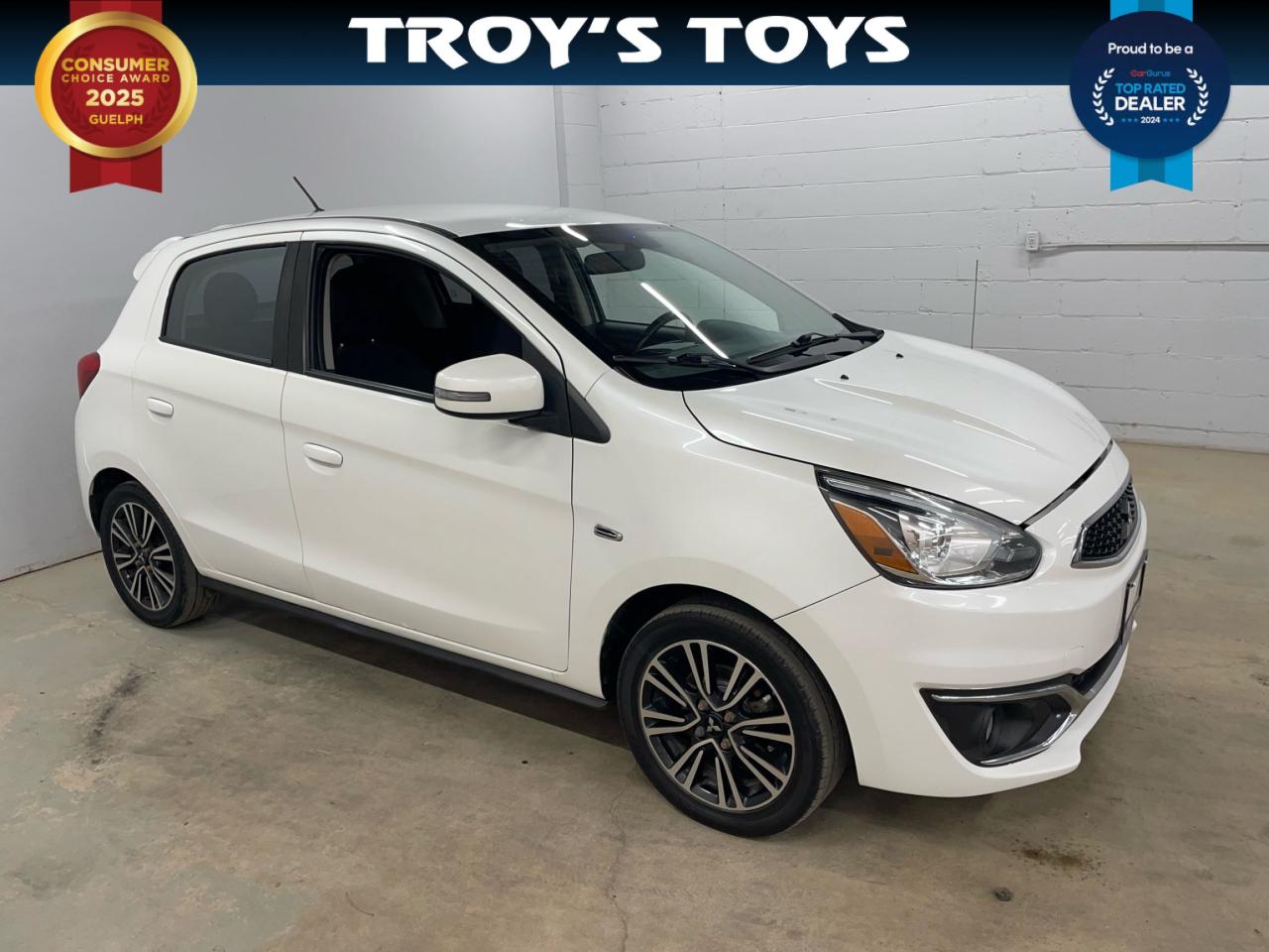 <p>Looking for an affordable and fuel-efficient ride thats perfect for navigating city streets? Check out this sleek white 2017 Mitsubishi Mirage 4dr HB CVT SEL, now available at Troys Toys! This compact hatchback offers a surprisingly spacious interior with comfortable black seating, making it ideal for both your daily commute and weekend adventures. This reliable Mirage boasts a fuel-sipping 1.2L I3 engine, ensuring you spend more time on the road and less time at the pump. With its automatic CVT transmission and front-wheel drive, youll enjoy a smooth and easy driving experience.</p><p>This Mirage comes equipped with a variety of features designed to enhance your driving experience. Youll be impressed by the fuel efficiency, saving you money at the pump. With 184,000km on the odometer, this Mirage has plenty of life left!</p><p>Here are five reasons why youll love this Mirage:</p><ul><li><strong>Fuel Sipping Performance:</strong> Get ready to save big on gas!</li><li><strong>City-Friendly Size:</strong> Maneuver effortlessly through tight spaces.</li><li><strong>Automatic CVT Transmission:</strong> Enjoy a smooth and easy driving experience.</li><li><strong>Hatchback Versatility:</strong> Offers ample cargo space.</li><li><strong>Reliable Mitsubishi Engineering:</strong> Built to last.</li></ul><p><strong><em>Powered by AutoIntelligence™</em></strong> Vehicle information has been generated using artificial intelligence and is provided for informational purposes only. While efforts are made to ensure accuracy, please confirm all details directly with the dealer.</p>