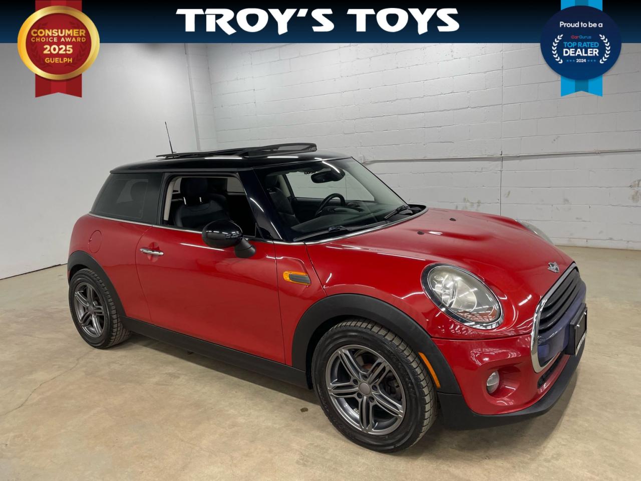 <p>Looking for a fun, sporty ride thats sure to turn heads? Check out this vibrant 2016 MINI Cooper Coupe, available now at Troys Toys! This feisty little car is ready to inject some excitement into your daily commute. With its iconic MINI styling and a striking red exterior, youll be cruising in style. This zippy two-door coupe is paired with a classic black interior and a manual transmission, offering a truly engaging driving experience. This spirited MINI has 161,419km on the odometer.</p><p>This MINI Cooper is a testament to driving pleasure. Its compact size makes it perfect for navigating city streets while still providing a comfortable ride. The manual transmission puts you in complete control, allowing you to experience the road in its purest form. With front-wheel drive, this MINI offers responsive handling and confident cornering, making every drive a joy. Stop by Troys Toys today and see it for yourself!</p><p>Here are 5 features that make this MINI Cooper a must-see:</p><ul><li><strong>Iconic Style:</strong> Turn heads with the instantly recognizable MINI Cooper design.</li><li><strong>Manual Transmission:</strong> Experience the thrill of a truly engaging drive.</li><li><strong>Sporty Coupe:</strong> Enjoy a sleek and sporty two-door design.</li><li><strong>Fuel Efficiency:</strong> Save money with this fuel-efficient ride.</li><li><strong>Compact Agility:</strong> Perfect for city driving and easy parking.</li></ul><p><strong><em>Powered by AutoIntelligence™</em></strong> Vehicle information has been generated using artificial intelligence and is provided for informational purposes only. While efforts are made to ensure accuracy, please confirm all details directly with the dealer.</p>