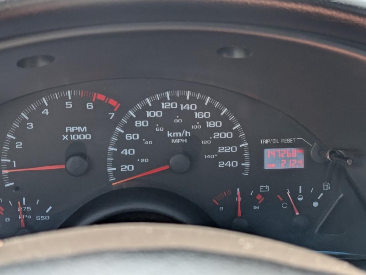 12870557