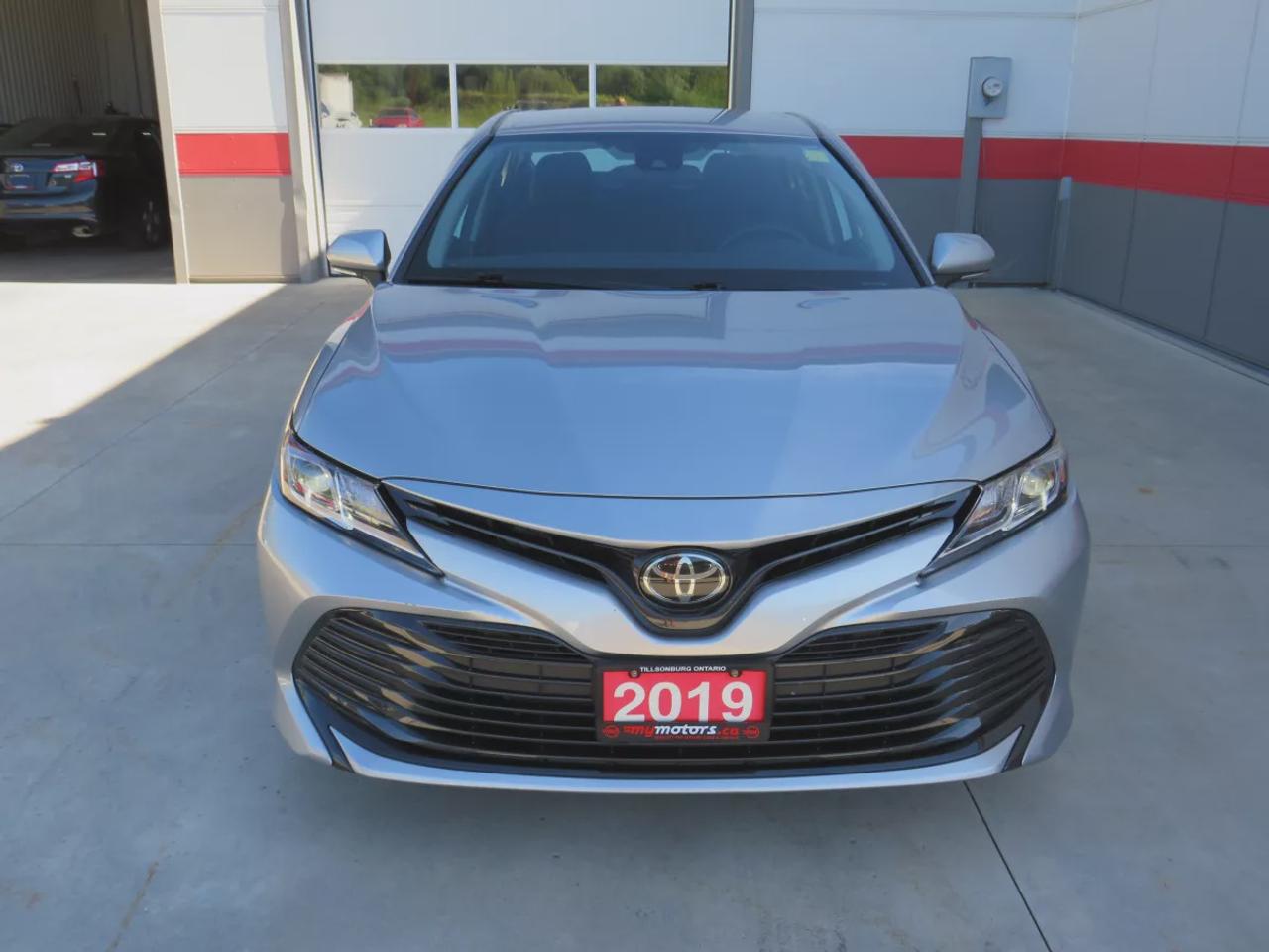 2019 Toyota Camry LE | Clean Title | No Accidents | Safety Certified | Power Seats | Lane Assist | Digital Touchscreen | Heated Seats | Reverse Camera | Traction Control | Bluetooth | Cruise Control Photo