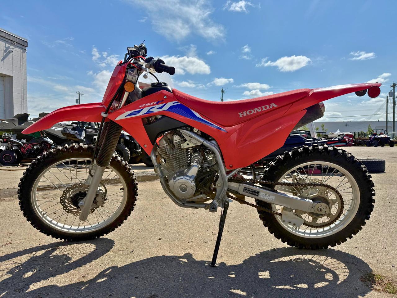 <p data-start=149 data-end=454>The 2024 Honda CRF250F is built to deliver trail-ready performance, reliability, and confidence for riders of all skill levels. Powered by a 249cc air-cooled single-cylinder four-stroke engine with electronic fuel injection, this bike delivers smooth, predictable power and easy starts in any condition.</p><p data-start=149 data-end=454>&nbsp;</p><p data-start=456 data-end=763>Purpose-built for versatility, the CRF250F features a five-speed transmission, a lightweight yet durable steel frame, and electric start for convenience on the trail. The closed-loop EFI system automatically adjusts to altitude and temperature changes, giving you consistent performance wherever you ride.</p><p data-start=456 data-end=763>&nbsp;</p><p data-start=765 data-end=1116>With long-travel suspension&mdash;41mm telescopic forks up front and Pro-Link single-shock rear suspension&mdash;the CRF250F soaks up bumps and ruts with ease. Front and rear disc brakes provide strong stopping power, while the bike&rsquo;s balanced geometry and manageable seat height make it approachable for newer riders while still being fun for experienced ones.</p><p data-start=765 data-end=1116>&nbsp;</p><p data-start=1118 data-end=1359>This trail bike also comes equipped with full off-road ergonomics, a comfortable saddle, lightweight wheels, and bold Honda styling. Inside, you&rsquo;ll find durable construction and rider-friendly features designed for years of dependable use.</p><p data-start=82 data-end=461>&nbsp;</p><p data-start=1361 data-end=1456 data-is-last-node= data-is-only-node=>Call or message us today to learn more about financing, trade-ins, or delivery across Canada.</p>