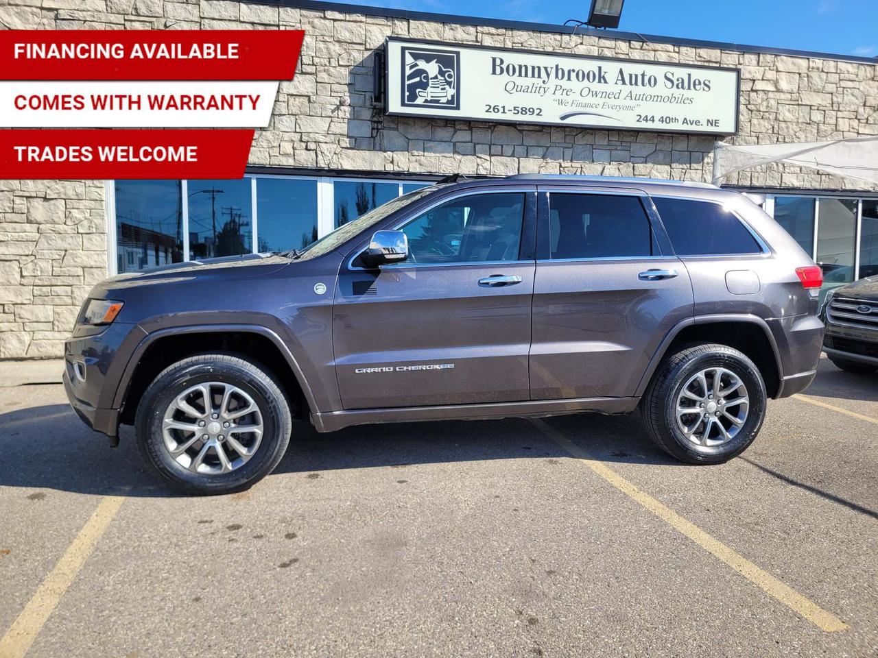 Need a vehicle that has style and class? Look at our Pre-Owned 2014 JEEP GRAND CHEROKEE OVERLAND 4X4 (Pictured in photo) Filled with top options including Heated Leather Seats, Keyless Entry, Bluetooth, Factory Car Starter, Navigation, Heated Steering wheel, Power Mirrors, Panoramic sunroof Power Locks, Power Windows. Rearview camera  Power Lift Gate/Air /Tilt /Cruise/Am/Fm Stereo Cd player comes with 6 month power train warranty with options to extend. Smooth ride at a great price thats ready for your test drive. Fully inspected and given a clean bill of health by our technicians. Fully detailed on the interior and exterior so it feels like new to you. There should never be any surprises when buying a used car, thats why we share our Mechanical Fitness Assessment and Carfax with our customers, so you know what we know. Bonnybrook Auto sales is helping thousands find quality used vehicles at prices they can afford. If you would like to book a test drive, have questions about a vehicle or need information on finance rates, give our friendly staff a call today! Bonnybrook auto sales is proudly one of the few car dealerships that have been serving Calgary for over Twenty years. /TRADE INS WELCOMED/ Amvic Licensed Business.  Due to the recent increase for used vehicles.  Demand and sales combined with  the U.S exchange rate, a lot  vehicles are being exported to the U.S. We are in need of pre-owned vehicles. We give top dollar for your trades.  We also purchase all makes and models of vehicles.
