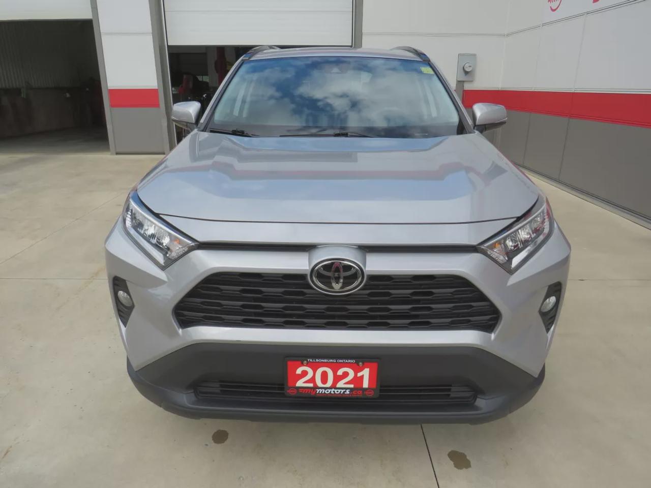 2021 Toyota RAV4 XLE  | Very Low Km | Clean Title | No Accidents | Safety Certified | Sunroof | Alloy Rims | Power Seats | Leather Wrapped Steering Wheel | Power Tailgate | Rear Cargo Mat | Rear Privacy Cover | Custom Toyota Floor Mats | Bluetooth | Cruise Control Photo