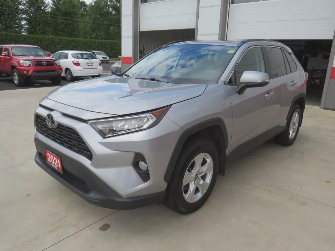 2021 Toyota RAV4 XLE  | Very Low Km | Clean Title | No Accidents | Safety Certified | Sunroof | Alloy Rims | Power Seats | Leather Wrapped Steering Wheel | Power Tailgate | Rear Cargo Mat | Rear Privacy Cover | Custom Toyota Floor Mats | Bluetooth | Cruise Control Photo
