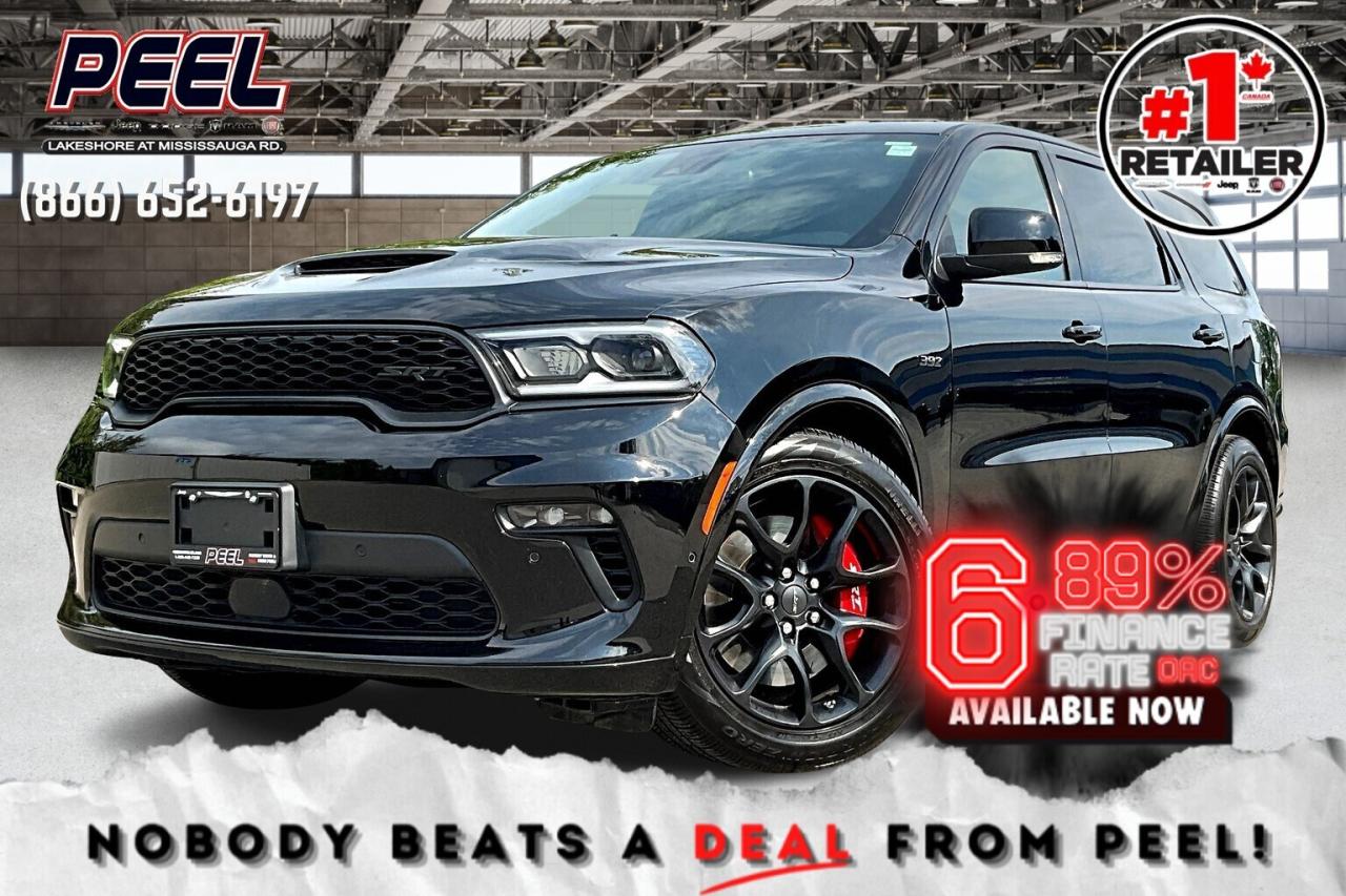 *6.89% promotional interest rate available on approved credit and qualifying vehicles (2022-2025 Preowned Vehicles and demos).  
COME SEE WHY NOBODY BEATS A DEAL FROM PEEL! Your Source for ALL make and models used cars and trucks. Canadas #1 Stellantis Retailer for 9 years & counting!!

2022 Dodge Durango SRT 392 AWD | 6.4L 392 HEMI V8 Engine | DB Black | FULLY LOADED | Black Package | SRT Interior Appearance Group | Leather/Suede Bucket Seats | Heated & Ventilated Seats | 19 Speaker Harman/Kardon Premium Audio System | Forged Carbon Fibre Interior Accents | Dinamica Suede Headliner | Power Sunroof | Uconnect 10.1" Touchscreen Display w/ Navigation | Second-row Captains Chairs w/ Centre Console | Apple CarPlay & Android Auto | Heated Steering Wheel | Remote Start | Blind Spot Monitoring | Parking Sensors | 20x10 Lights Out Wheels | Red SRT Brembo High Performance Brakes | High Performance Suspension | Trailer Tow Group IV | Class IV Hitch Receiver | Trailer Brake Control

One Owner - Compustar Engine Immobilizer Anti Theft System Installed 

Unleash raw muscle and luxury in this fully loaded 2022 Dodge Durango SRT 392 AWD, finished in DB Black and powered by the legendary 6.4L 392 HEMI V8. Inside, the SRT Interior Appearance Group surrounds you with leather and suede bucket seats, forged carbon fibre accents, a Dinamica suede headliner, and second-row captains chairs with a centre console for added comfort. Heated and ventilated seating, a heated steering wheel, and a power sunroof make every drive enjoyable, while the Uconnect 10.1-inch touchscreen with navigation, Apple CarPlay, Android Auto, and a 19-speaker Harman/Kardon Premium Audio System keep you connected and entertained. Confidence comes standard with blind spot monitoring, parking sensors, and remote start. On the outside, the Black Package pairs with 20x10 Lights Out wheels, red SRT Brembo high performance brakes, and a high performance suspension for a commanding presence and incredible handling. Equipped with the Trailer Tow Group IV, Class IV hitch receiver, and trailer brake control, this SRT 392 blends brute strength with everyday practicality. With only one previous owner, this Durango delivers the ultimate mix of performance, refinement, and family-friendly versatility.
______________________________________________________

Engage & Explore with Peel Chrysler: Whether youre inquiring about our latest offers or seeking guidance, 1-866-652-6197 connects you directly. Dive deeper online or connect with our team to navigate your automotive journey seamlessly.

WE TAKE ALL TRADES & CREDIT. WE SHIP ANYWHERE IN CANADA! OUR TEAM IS READY TO SERVE YOU 7 DAYS!
______________________________________________________
Our advertised prices are for consumers (i.e end users) only. 

*FREE CarFax (click the link above to check it out at no cost to you!)*

*FULLY CERTIFIED! (Have you seen some of these other dealers stating in their advertisements that certification is an additional fee? NOT HERE! Our certification is already included in our low sale prices to save you more!)

______________________________________________________

Peel Chrysler  A Trusted Destination: Based in Port Credit, Ontario, we proudly serve customers from all corners of Ontario and Canada including Toronto, Oakville, North York, Richmond Hill, Ajax, Hamilton, Niagara Falls, Brampton, Thornhill, Scarborough, Vaughan, London, Windsor, Cambridge, Kitchener, Waterloo, Brantford, Sarnia, Pickering, Huntsville, Milton, Woodbridge, Maple, Aurora, Newmarket, Orangeville, Georgetown, Stouffville, Markham, North Bay, Sudbury, Barrie, Sault Ste. Marie, Parry Sound, Bracebridge, Gravenhurst, Oshawa, Ajax, Kingston, Innisfil and surrounding areas. On our website www.peelchrysler.com, you will find a vast selection of new vehicles including the new and used Ram 1500, 2500 and 3500. Chrysler Grand Caravan, Chrysler Pacifica, Jeep Cherokee, Wrangler and more. All vehicles are priced to sell. We deliver throughout Canada. website or call us 1-866-652-6197. 

Disclaimer Statement: At Peel Chrysler, your satisfaction is our priority. While many pre-owned vehicles originally come with two keys, variations may occur based on trade-ins, and all Peel Chrysler Pre-Owned Vehicles come standard with one key. Any extras provided by the previous owner will be included with your purchase, and additional keys can be bought at the time of sale. Online prices and payments are for finance purchases. Used vehicles that are being financed are subject to a $499 (^$1500 non-prime) financing fee, while cash purchases (certified cheque, bank draft, or wire transfer) on used vehicles have a $2,000 surcharge ( online price + $2,000). Cash purchases of new vehicles only incur applicable taxes and licensing fees, and those priced above $100,000 (including accessories or add-ons) are subject to a federal luxury tax. Optional finance and lease terms are available, and if trading in a vehicle with an outstanding loan balance requiring Peel Chrysler to facilitate the lien payout, a Lien Payout Fee of $349 applies. Prices, rates, and payments are subject to change without notice. While we strive for accuracy, occasional technical or human errors may occur, so we encourage verifying all vehicle details, including features, options, materials, and specifications, with a Peel Chrysler representative by contacting us or visiting our dealership. Experience seamless convenience with our nationwide delivery options. Visit our website or contact us for more details.