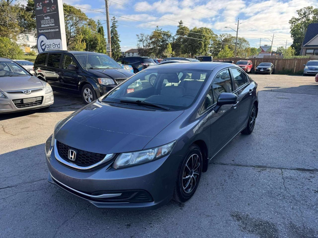 2015 Honda Civic 4dr Man LX Photo3