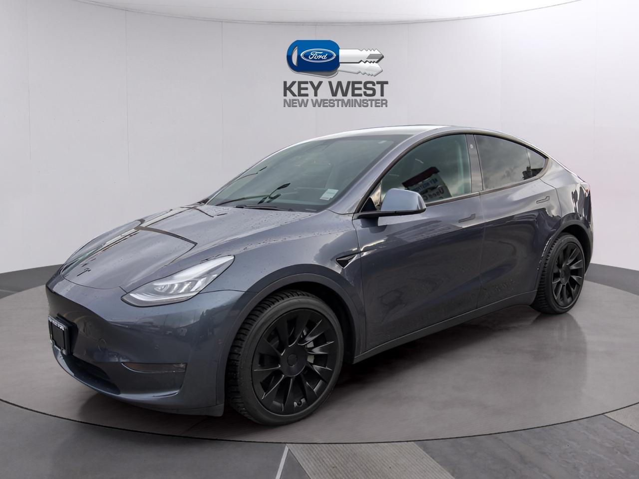 <p>Cruise into the future with this stunning 2021 Tesla Model Y Long Range AWD, now available at Key West Ford! This sleek, all-electric SUV in a sophisticated grey exterior offers a seamless blend of performance and innovation, perfect for the modern Canadian driver. With its automatic transmission and all-wheel drive, youll experience a smooth, powerful ride in any weather condition. This Model Y has a comfortable 83,225km on the odometer, ready to take you on countless adventures.</p><p>This electric marvel boasts a suite of cutting-edge features designed to elevate your driving experience. The Model Y seamlessly integrates technology and luxury, making every journey enjoyable and effortless. This SUV is a testament to Teslas commitment to creating vehicles that are not only environmentally friendly, but also fun to drive.</p><p>Here are five features that make this Model Y a must-see:</p><ul><li><strong>Instant Torque:</strong> Experience exhilarating acceleration from the moment you hit the pedal.</li><li><strong>Autopilot Capabilities:</strong> Enjoy a more relaxed and confident driving experience with advanced driver-assistance features.</li><li><strong>Spacious Interior:</strong> Revel in the generous cabin space, providing ample room for passengers and cargo.</li><li><strong>Over-the-Air Updates:</strong> Stay up-to-date with the latest software enhancements and new features, all delivered wirelessly.</li><li><strong>Panoramic Glass Roof:</strong> Immerse yourself in the open-air feel and enjoy breathtaking views.</li></ul><p><strong><em>Powered by AutoIntelligence&trade;</em></strong> Vehicle information has been generated using artificial intelligence and is provided for informational purposes only. While efforts are made to ensure accuracy, please confirm all details directly with the dealer.</p><p>Experience peace of mind with our Buy With Confidence program! This vehicle comes with a comprehensive mechanical and safety inspection, Carfax report, and full disclosure. We are committed to transparent pricing. The advertised price excludes fees: $699 Documentation, $349 Registration/Insurance Transfer, $695 Finance Administration Fee (if applicable), and taxes. As BCs #1 Volume Dealer and #1 for Customer Experience on DealerRater, we prioritize your satisfaction. See Key West Ford for complete details. Book your test drive today!&nbsp; Dealer #7485</p>
