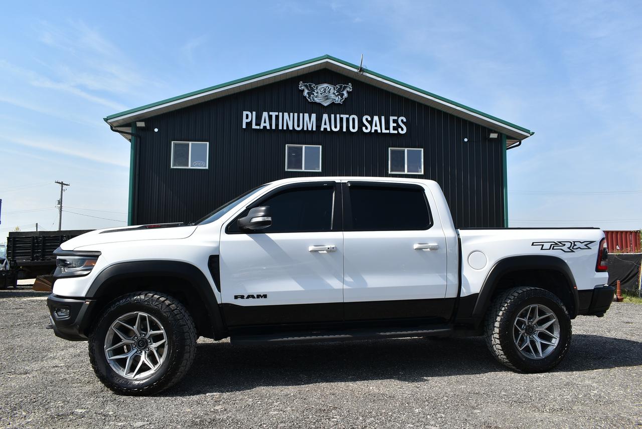 <p data-start=92 data-end=151>&nbsp;</p><p>🚨🔥 MEGA BLOWOUT SALE 🔥🚨<br>🏆 BEST PRICE IN ALL OF CANADA 🏆</p><p>🚫 NO GAMES &bull; NO MARKUPS &bull; JUST A MONSTER DEAL 🚫</p><p>🔥 2021 RAM 1500 TRX 🔥<br>⚡ SUPERCHARGED 702HP BEAST ⚡</p><p>📍 AVAILABLE RIGHT NOW @ PLATINUM AUTO SALES<br>🚨 THIS TRUCK WILL NOT LAST 🚨</p><p>✅ BLOWOUT DEAL INCLUDES:</p><p>🔥 ONLY 88,119 KM<br>🔥 6.2L SUPERCHARGED HEMI V8<br>🔥 702 HORSEPOWER / 650 LB-FT TORQUE<br>🔥 8 SPEED AUTOMATIC<br>🔥 FULL TIME 4X4 &ndash; BAJA MODE READY<br>🔥 20 FUEL RIMS + 35&rdquo; ALL TERRAIN TIRES<br>🔥 MOPAR TRI-FOLD TONNEAU COVER</p><p>🚀 PERFORMANCE THAT DESTROYS EVERYTHING:</p><p>💥 0-100 KM/H IN 4.5 SECONDS<br>💥 BILSTEIN BLACK HAWK e2 ADAPTIVE SHOCKS<br>💥 LAUNCH CONTROL + PERFORMANCE PAGES<br>💥 DRIVE MODES: SPORT / SNOW / MUD-SAND / ROCK / TOW / CUSTOM / BAJA<br>💥 HEAVY DUTY SKID PLATES + FACTORY OFF-ROAD LIFT<br>💥 REINFORCED OFF-ROAD CHASSIS BUILT TO TAKE A BEATING</p><p>🛋 LUXURY INTERIOR + TECH LOADED:</p><p>✨ TRX PREMIUM LEATHER & SUEDE SPORT INTERIOR<br>✨ HEATED & VENTILATED FRONT + REAR SEATS<br>✨ HEATED STEERING WHEEL<br>✨ 12&rdquo; UCONNECT TOUCHSCREEN<br>✨ APPLE CARPLAY + ANDROID AUTO<br>✨ HARMAN KARDON PREMIUM SOUND SYSTEM<br>✨ DUAL PANE PANORAMIC SUNROOF<br>✨ WIRELESS CHARGING + USB-C + FULL TECH PACKAGE</p><p>⚡ THIS IS NOT A TRUCK&hellip;<br>🚨 THIS IS A SUPERCHARGED WEAPON 🚨</p><p>If you want the meanest truck on the road, the TRX is KING 👑<br>And this one is priced to MOVE FAST.</p><p>⏳ FIRST COME FIRST SERVED<br>🚫 NO HOLDS WITHOUT DEPOSIT<br>📌 SERIOUS BUYERS ONLY</p><p>📞 CALL OR TEXT PLATINUM AUTO SALES NOW</p><p>🔥 BEFORE SOMEONE ELSE TAKES IT 🔥</p><p>DEALER PERMIT #4744<br>STOCK #1607</p><pre><strong><span style=color: #3e4153; font-family: Larsseit, Arial, sans-serif; font-size: 16px; white-space: pre-line; background-color: #f8f9f9;>DEALER PERMIT # 4744<br><br></span></strong>STOCK # 1607<br><br><span style=color: #3e4153; font-family: Larsseit, Arial, sans-serif; font-size: 16px; white-space: pre-line; background-color: #f8f9f9;>FRESH MB SAFETY</span><br><br><span style=color: #3e4153; font-family: Larsseit, Arial, sans-serif; font-size: 16px; white-space: pre-line; background-color: #f8f9f9;>200 POINT INSPECTION SO YOU CAN BUY WITH CONFIDENCE</span><br><br><span style=color: #3e4153; font-family: Larsseit, Arial, sans-serif; font-size: 16px; white-space: pre-line; background-color: #f8f9f9;>CARFAX available</span><br><br><span style=color: #3e4153; font-family: Larsseit, Arial, sans-serif; font-size: 16px; white-space: pre-line; background-color: #f8f9f9;>LOW RATE FINANCING AVAILABLE *OAC</span><br><br><span style=color: #3e4153; font-family: Larsseit, Arial, sans-serif; font-size: 16px; white-space: pre-line; background-color: #f8f9f9;>All trades considered</span><br><br><span style=color: #3e4153; font-family: Larsseit, Arial, sans-serif; font-size: 16px; white-space: pre-line; background-color: #f8f9f9;>Extended Warranty available</span><br><br><span style=color: #3e4153; font-family: Larsseit, Arial, sans-serif; font-size: 16px; white-space: pre-line; background-color: #f8f9f9;><strong>Platinum Auto Sales </strong></span><span style=color: #3e4153; font-family: Larsseit, Arial, sans-serif;><span style=font-size: 16px; white-space: pre-line;><strong>conveniently</strong></span></span><strong style=color: #3e4153; font-family: Larsseit, Arial, sans-serif; font-size: 16px; white-space: pre-line;>&nbsp;located off the East Perimeter Hwy at our NEW LOCATION 240 TRANSPORT RD!</strong></pre><pre><br><span style=color: #3e4153; font-family: Larsseit, Arial, sans-serif; font-size: 16px; white-space: pre-line; background-color: #f8f9f9;>THE MPI TIRE PROGRAM IS AVAILABLE MSG FOR DETAILS</span><br><br><span style=color: #3e4153; font-family: Larsseit, Arial, sans-serif; font-size: 16px; white-space: pre-line; background-color: #f8f9f9;>MPI GLASS DIRECT REPAIR/REPLACEMENT</span><br><br><span style=color: #3e4153; font-family: Larsseit, Arial, sans-serif; font-size: 16px; white-space: pre-line; background-color: #f8f9f9;>Open 6 days a week Mon-Friday 9-6 Sat 9-4</span><br><br><strong><span style=color: #3e4153; font-family: Larsseit, Arial, sans-serif; font-size: 16px; white-space: pre-line; background-color: #f8f9f9;>REMEMBER THERES NO BETTER DEAL THEN A PLATINUM DEAL!</span></strong><br><br><br><br><br><span style=color: #3e4153; font-family: Larsseit, Arial, sans-serif; font-size: 16px; white-space: pre-line; background-color: #f8f9f9;>Disclaimer: Please call dealership for availability. Price excludes taxes. Accepted payment methods: Cash, Debit, Certified Cheque, Bank Draft & Credit Cards(surcharge applies to all credit card purchases over $1000).</span></pre>