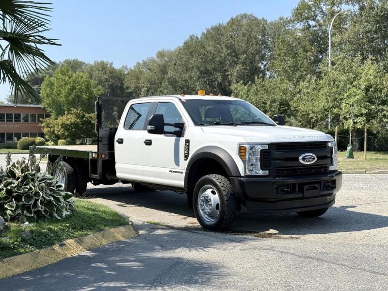 Used 2018 Ford F-550 XL 12-Foot Flat Deck Truck 4X4 Diesel for sale in Burnaby, BC