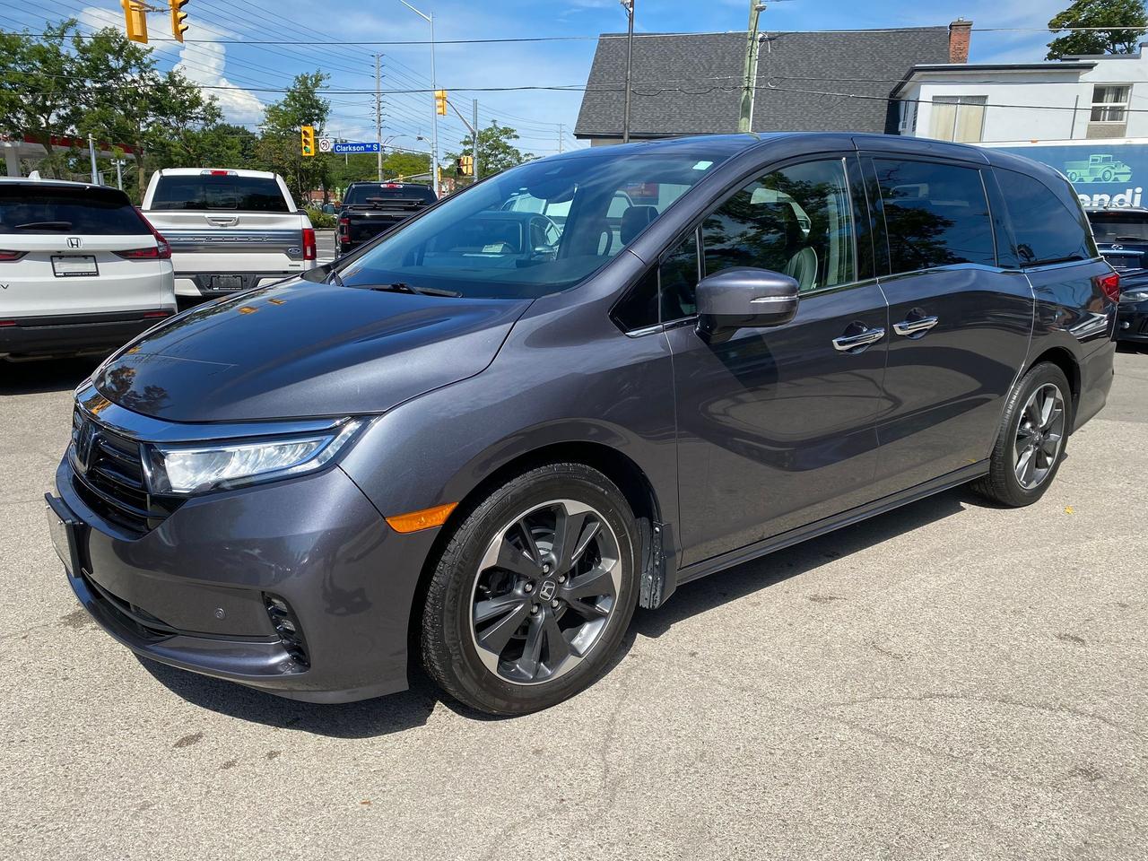<p data-path-to-node=0><strong data-path-to-node=0 data-index-in-node=0>2023 Honda Odyssey Touring &ndash; Modern Steel Metallic &ndash; 50,900 KM</strong></p><p data-path-to-node=1><strong data-path-to-node=1 data-index-in-node=0>Description:</strong> Experience the pinnacle of family travel with this loaded <strong data-path-to-node=1 data-index-in-node=71>2023 Honda Odyssey Touring</strong>. Finished in a sophisticated <strong data-path-to-node=1 data-index-in-node=127>Charcoal Grey (Modern Steel Metallic)</strong> over a refined <strong data-path-to-node=1 data-index-in-node=180>Black Leather</strong> interior, this minivan offers a premium cabin experience combined with Honda&rsquo;s legendary reliability.</p><p data-path-to-node=2>With <strong data-path-to-node=2 data-index-in-node=5>50,900 km</strong>, this Touring trim is the highest level of luxury available for the Odyssey. It is designed to keep every passenger comfortable and entertained, featuring a state-of-the-art <strong data-path-to-node=2 data-index-in-node=189>Rear Entertainment System</strong> and a whisper-quiet cabin. Whether you&rsquo;re managing daily school runs or embarking on a cross-country road trip, this Odyssey provides the space, safety, and technology your family deserves.</p><p data-path-to-node=3><strong data-path-to-node=3 data-index-in-node=0>Pricing & Transparency:</strong></p><ul data-path-to-node=4><li><p data-path-to-node=4,0,0><strong data-path-to-node=4,0,0 data-index-in-node=0>Certified:</strong> This vehicle is sold fully certified following a comprehensive safety inspection.</p></li><li><p data-path-to-node=4,1,0><strong data-path-to-node=4,1,0 data-index-in-node=0>All-In Pricing:</strong> Our price includes the <strong data-path-to-node=4,1,0 data-index-in-node=39>Admin Fee</strong> and <strong data-path-to-node=4,1,0 data-index-in-node=53>OMVIC fee</strong>.</p></li><li><p data-path-to-node=4,2,0><em data-path-to-node=4,2,0 data-index-in-node=0>Note: Price is plus HST and Licensing.</em></p></li></ul><p data-path-to-node=5><strong data-path-to-node=5 data-index-in-node=0>Performance & Mechanical Highlights:</strong></p><ul data-path-to-node=6><li><p data-path-to-node=6,0,0><strong data-path-to-node=6,0,0 data-index-in-node=0>Engine:</strong> 3.5L V6 with Variable Cylinder Management (280 hp)</p></li><li><p data-path-to-node=6,1,0><strong data-path-to-node=6,1,0 data-index-in-node=0>Transmission:</strong> 10-Speed Automatic with Grade Logic Control</p></li><li><p data-path-to-node=6,2,0><strong data-path-to-node=6,2,0 data-index-in-node=0>Drive:</strong> Front-Wheel Drive (FWD)</p></li><li><p data-path-to-node=6,3,0><strong data-path-to-node=6,3,0 data-index-in-node=0>Efficiency:</strong> Advanced fuel-saving technology for optimized highway cruising.</p></li></ul><p data-path-to-node=7><strong data-path-to-node=7 data-index-in-node=0>Key Features & Technology:</strong></p><ul data-path-to-node=8><li><p data-path-to-node=8,0,0><strong data-path-to-node=8,0,0 data-index-in-node=0>Entertainment:</strong> Rear Entertainment System with high-resolution screen and integrated Rear Side Shades.</p></li><li><p data-path-to-node=8,1,0><strong data-path-to-node=8,1,0 data-index-in-node=0>Navigation & Vision:</strong> Factory Navigation System, high-definition Rearview Camera, and Blind Spot Indicators.</p></li><li><p data-path-to-node=8,2,0><strong data-path-to-node=8,2,0 data-index-in-node=0>Safety:</strong> Honda Sensing Technologies including Lane Departure Alert and Collision Mitigation.</p></li><li><p data-path-to-node=8,3,0><strong data-path-to-node=8,3,0 data-index-in-node=0>Luxury Comfort:</strong> Leather-trimmed heated front seats, heated steering wheel, and a Wireless Charging Pad.</p></li><li><p data-path-to-node=8,4,0><strong data-path-to-node=8,4,0 data-index-in-node=0>Convenience:</strong> Power Sliding Side Doors, Power Tailgate, Keyless Go (Smart Entry), and a Factory Remote Engine Starter.</p></li><li><p data-path-to-node=8,5,0><strong data-path-to-node=8,5,0 data-index-in-node=0>Seating:</strong> Versatile Magic Slide 2nd-Row Seats for easy access to the third row.</p></li></ul><p data-path-to-node=9><strong data-path-to-node=9 data-index-in-node=0>Location:</strong> Mississauga, ON <strong data-path-to-node=9 data-index-in-node=26>Contact:</strong> 905-823-5535 | sales@mac.ca</p>